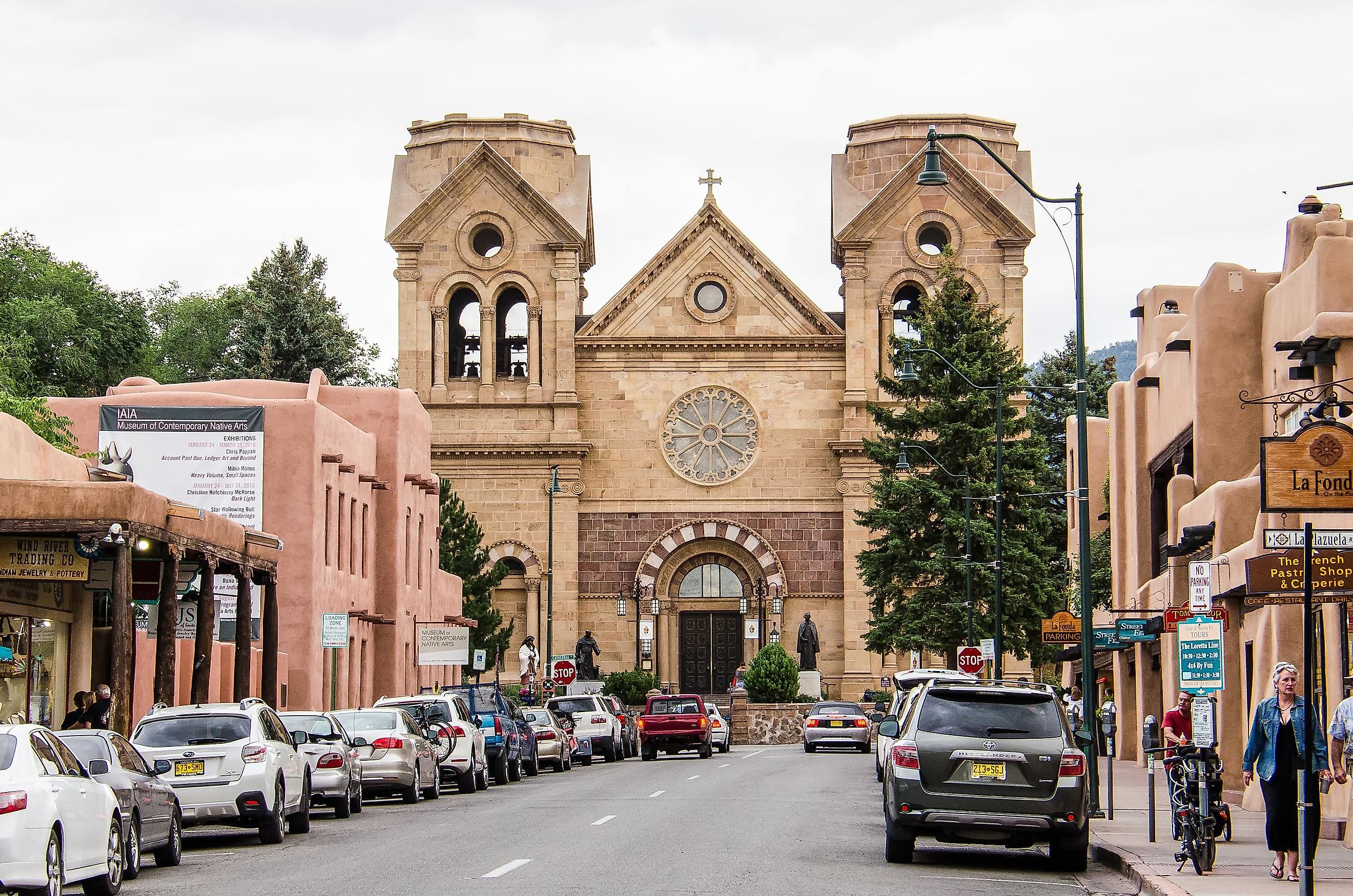 Santa Fe: downtown city street with parked cars and Cathedral Basilica of St. Francis of Assisi in New Mexico