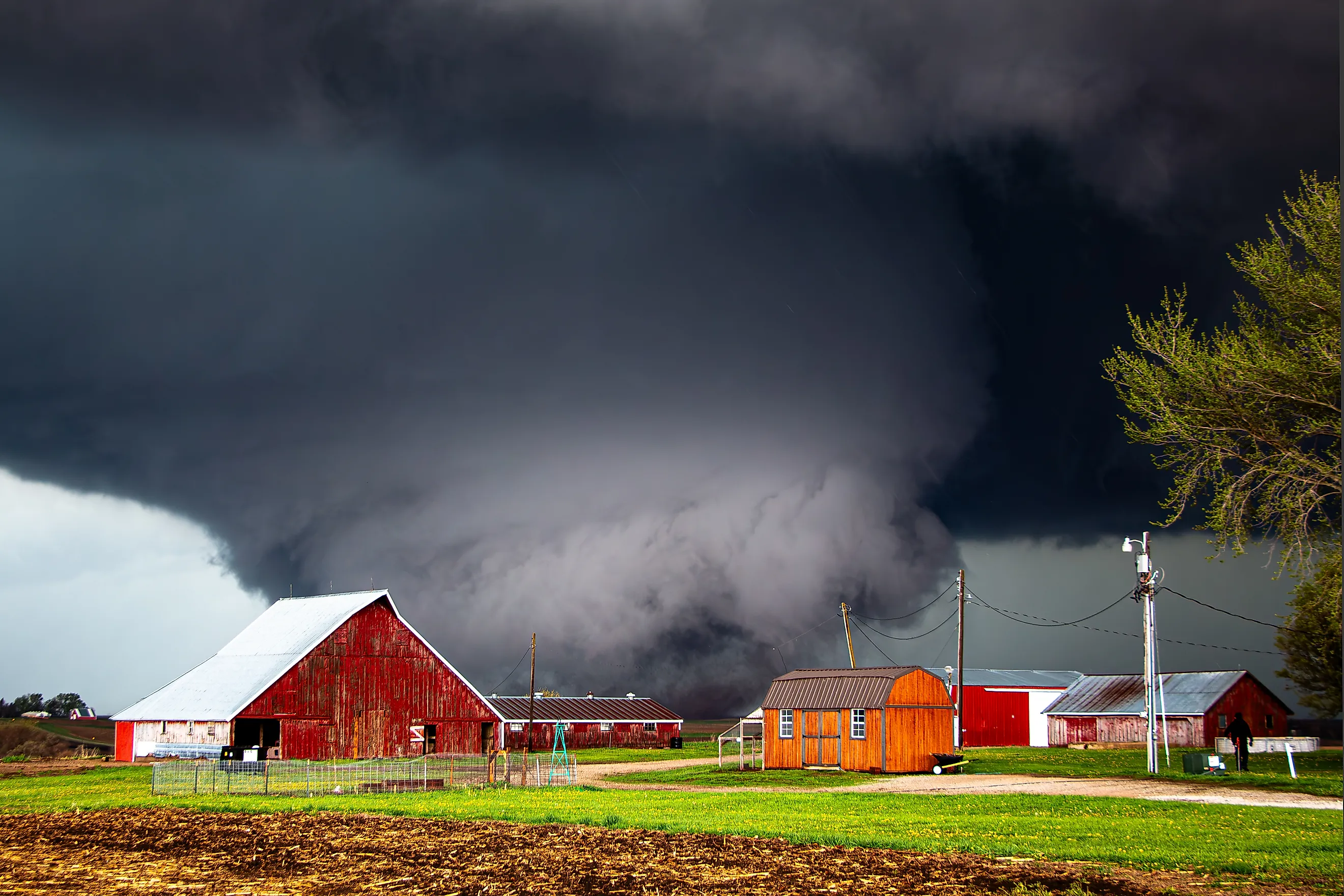 Large tornado passing through a farm between Minden, IA and Harlan, IA