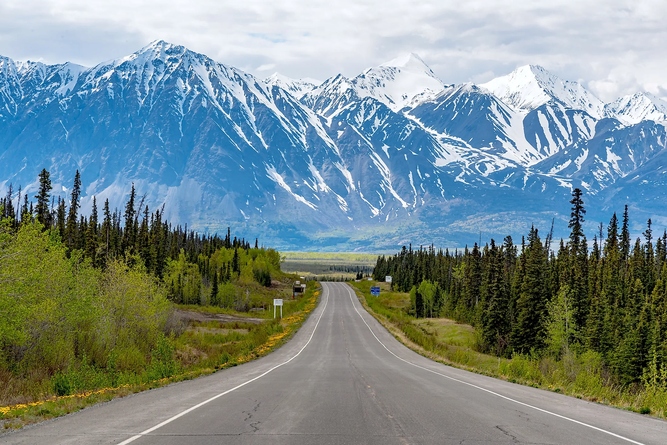 The Alaska Highway passing through the spectacular mountains of Alaska.