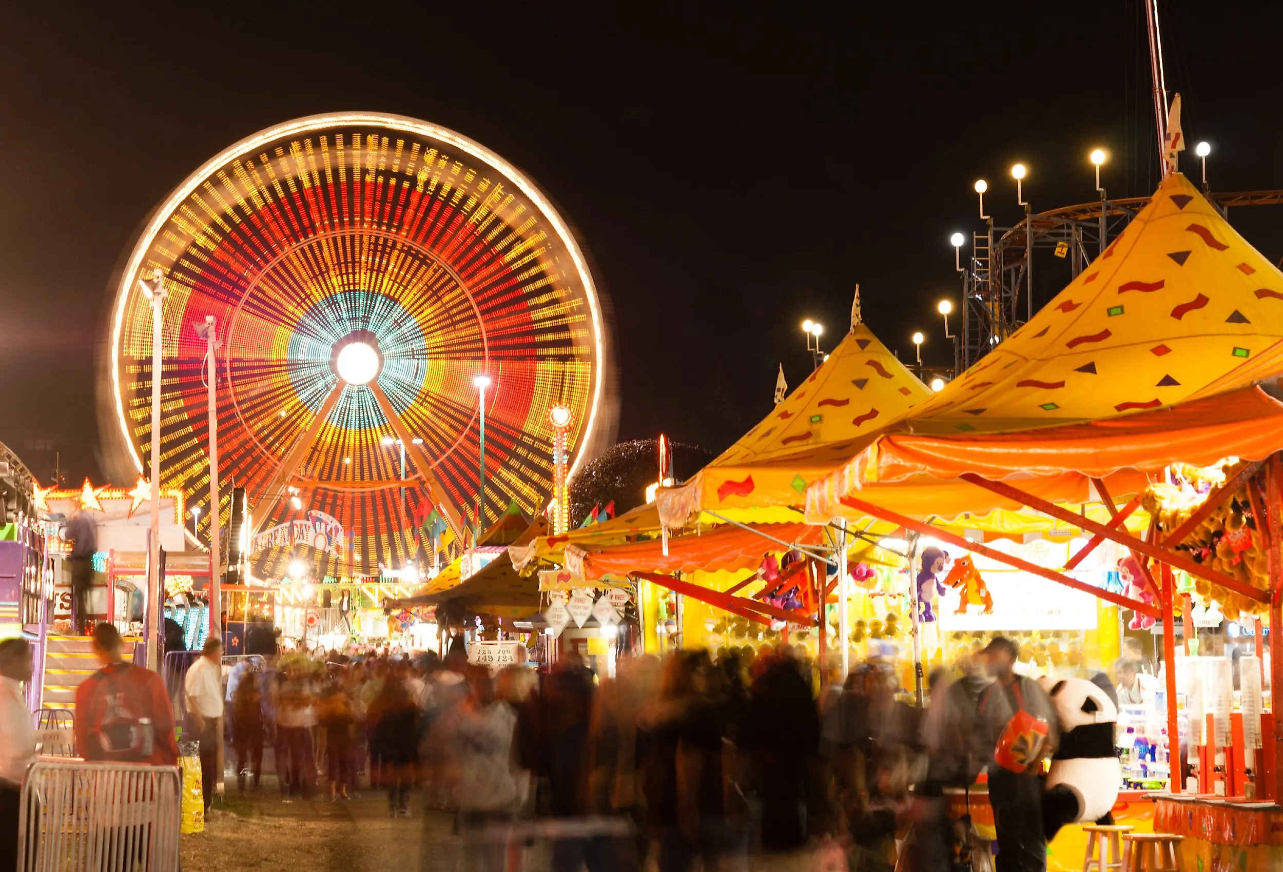 State Fair with carnival, midway, games, rides, and a Ferris wheel.