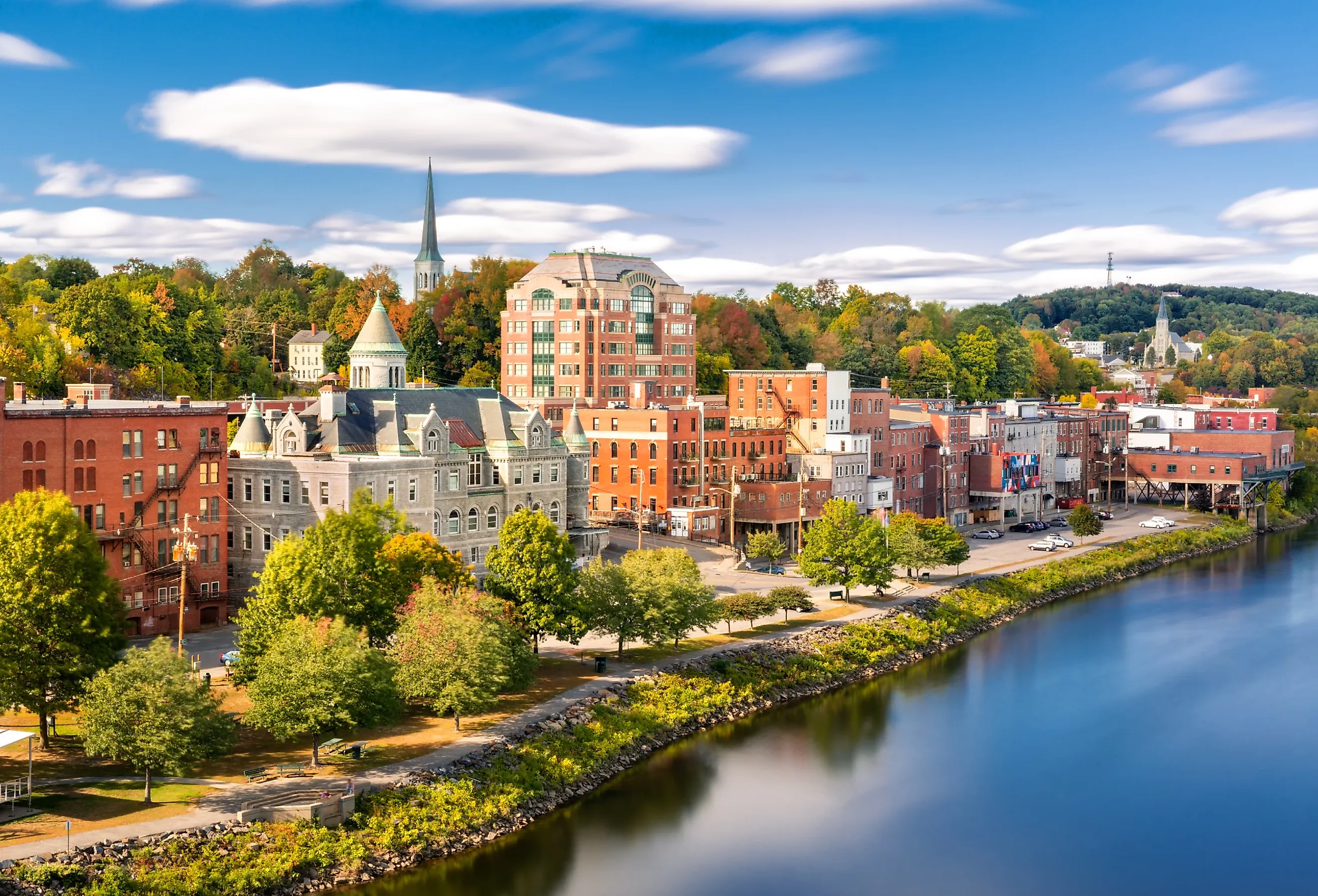 Augusta, Maine skyline along the water on a sunny afternoon.