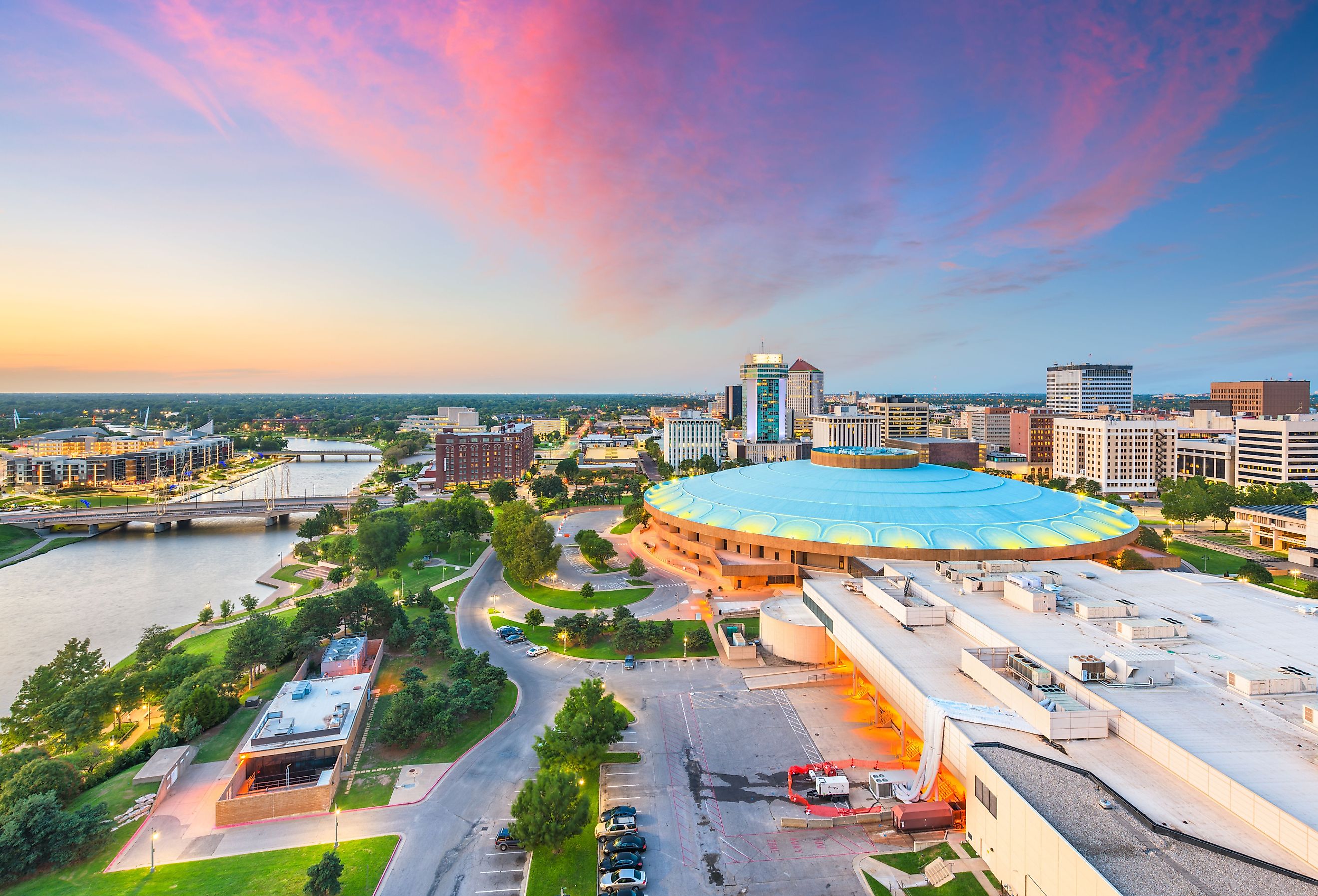 Wichita, Kansas, downtown city skyline and the Arkansas River at dusk