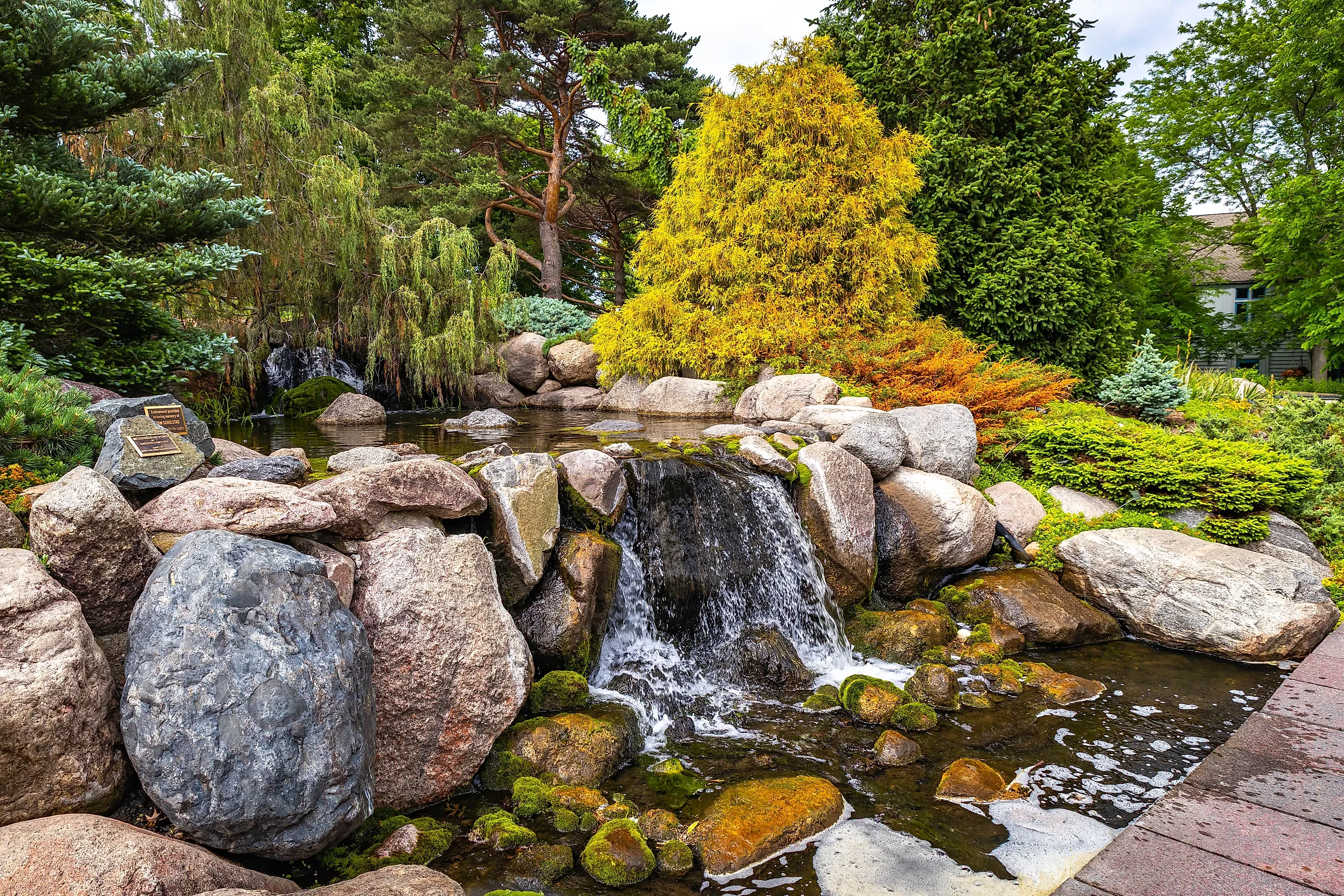 Scenic waterfall at Minnesota Landscape Arboretum. Credit: Photo Spirit/Shutterstock.com