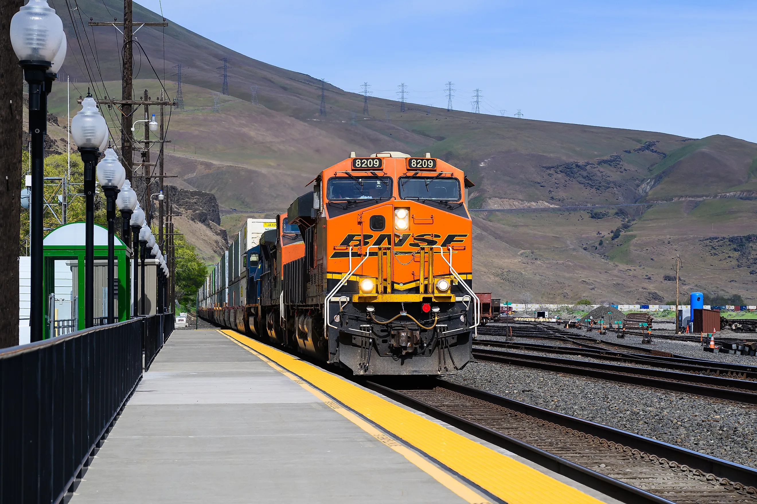 Freight train passing Wishram, Washington. Editorial photo credit: Ian Dewar Photography/Shutterstock
