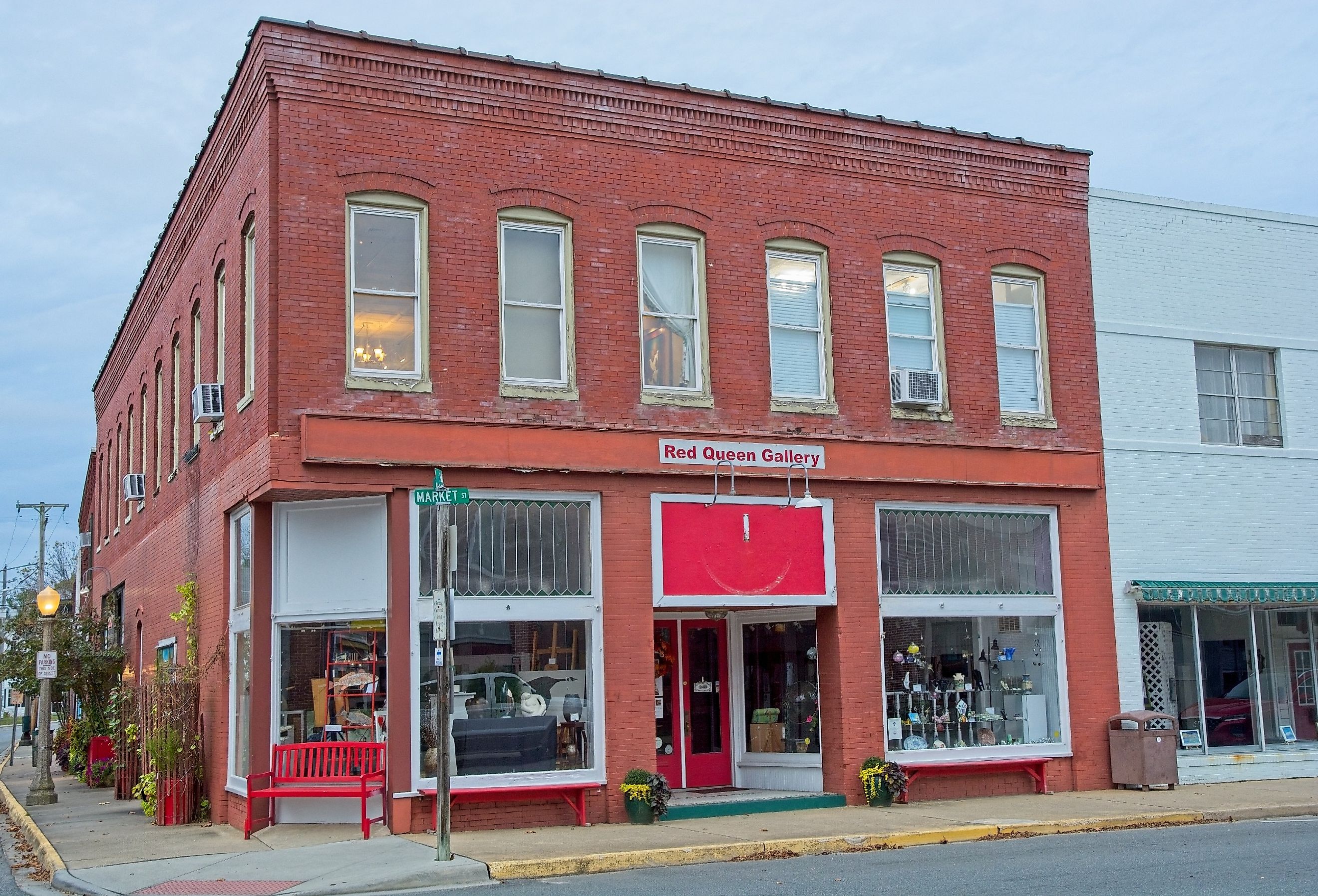 Red brick early 20th century store front on Market street housing the Red Queen Gallery, Onancock Virginia. Image credit John Blottman via Shutterstock