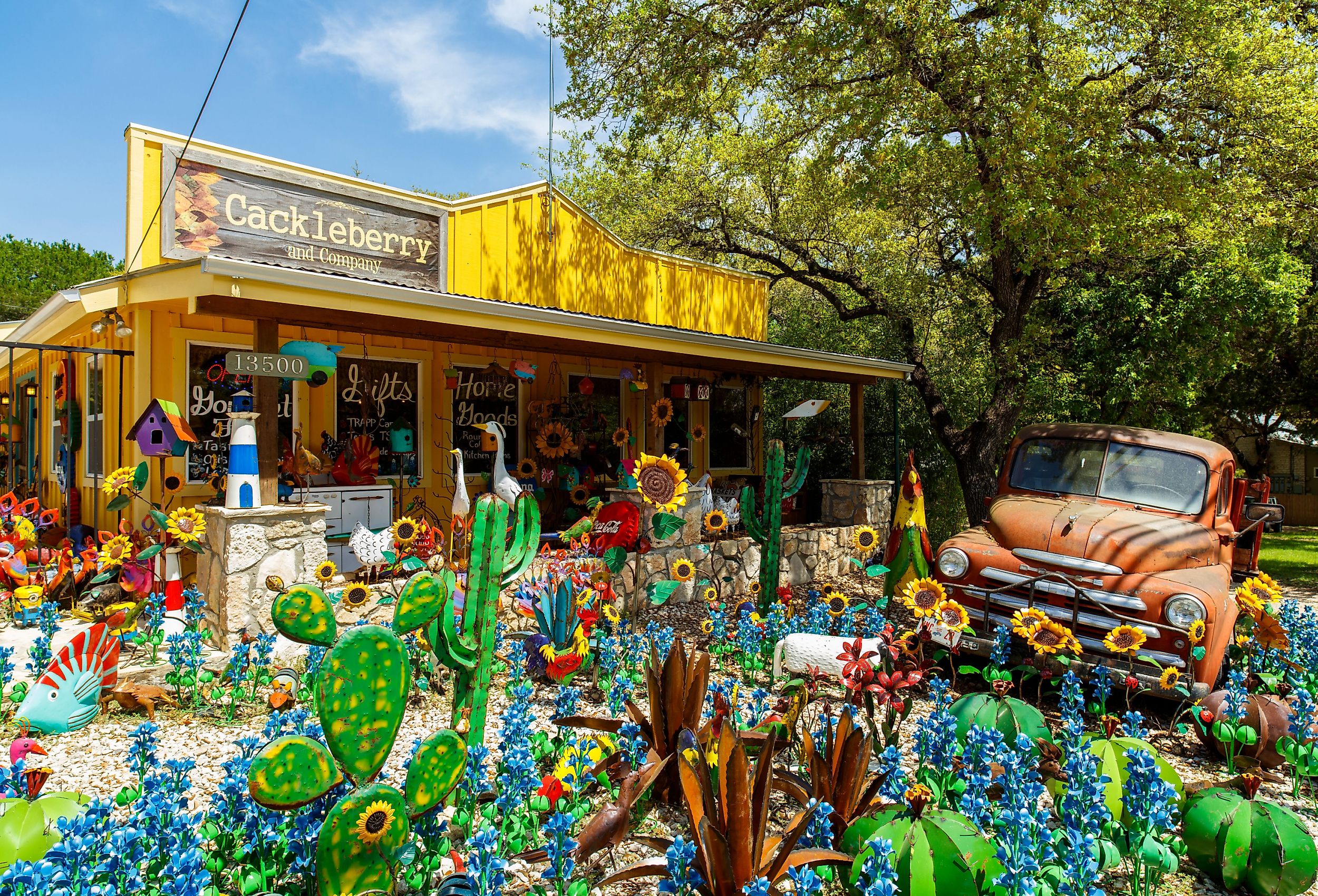 Colorful shop with artwork on display in the small Texas Hill Country town of Wimberley, Texas. Image credit Fotoluminate LLC via Shutterstock