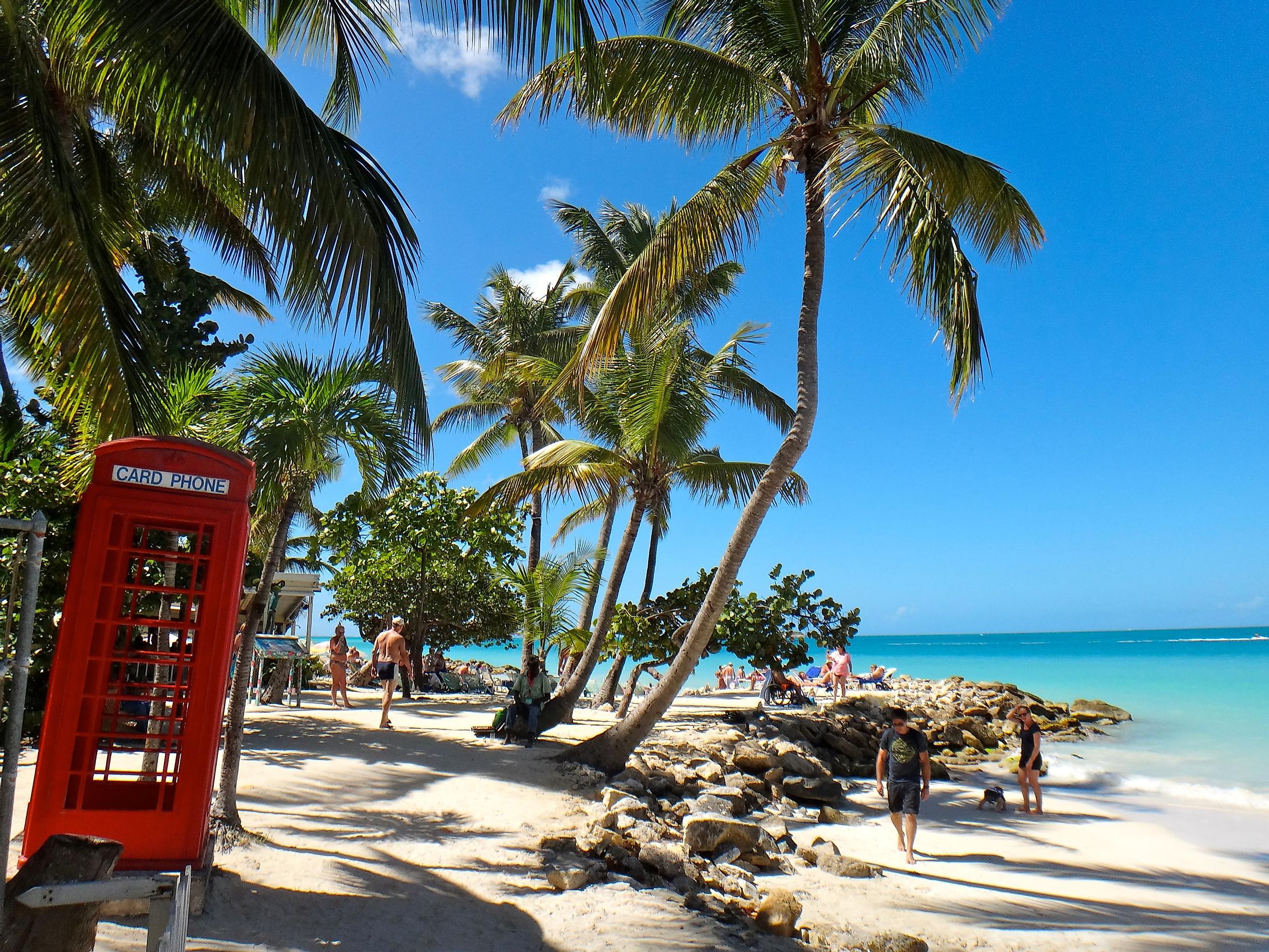 British phone booth on the beach at St. John's, Antigua and Barbuda.
