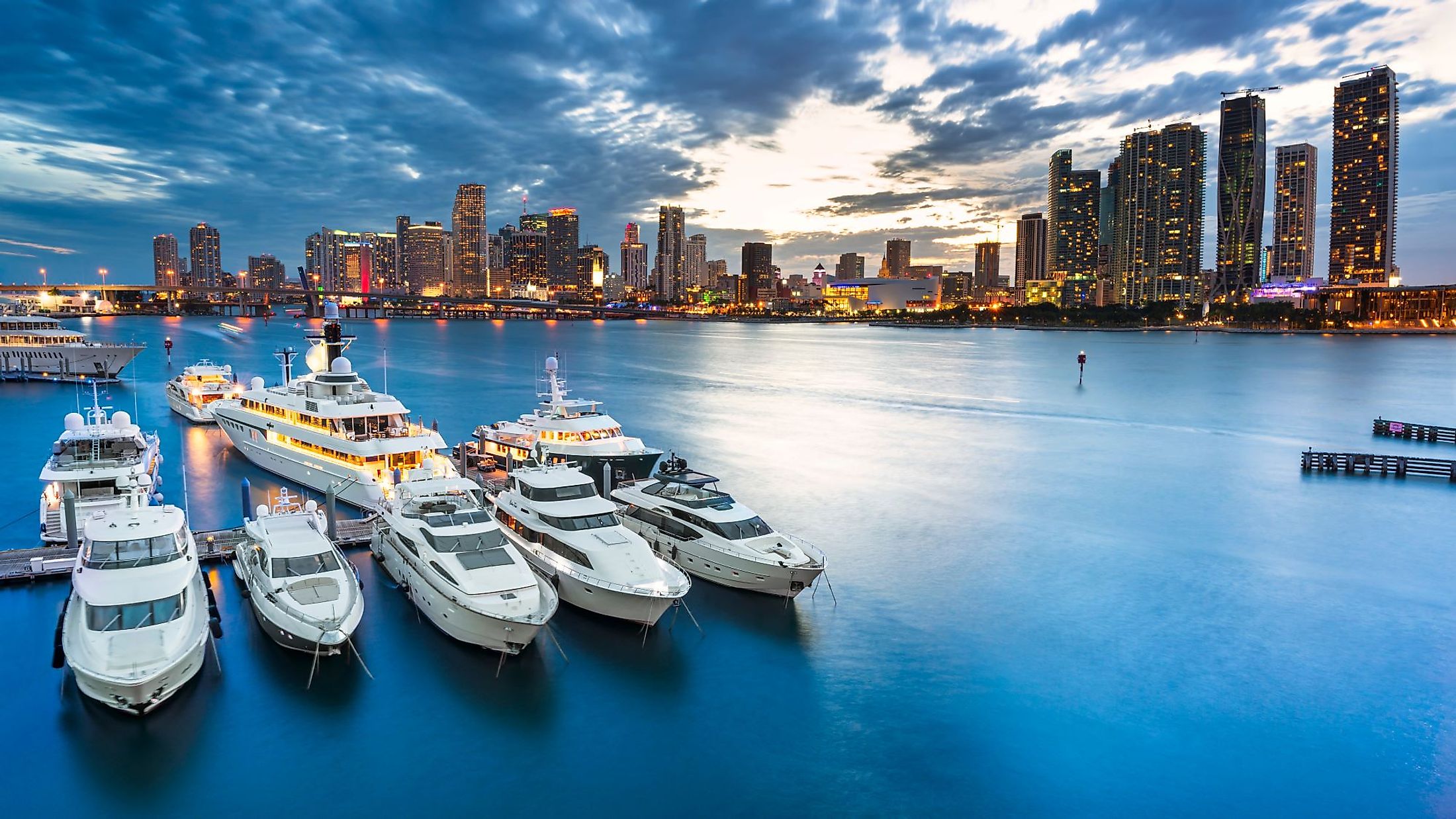 Miami, Florida skyline at dusk on a cloudy evening. 