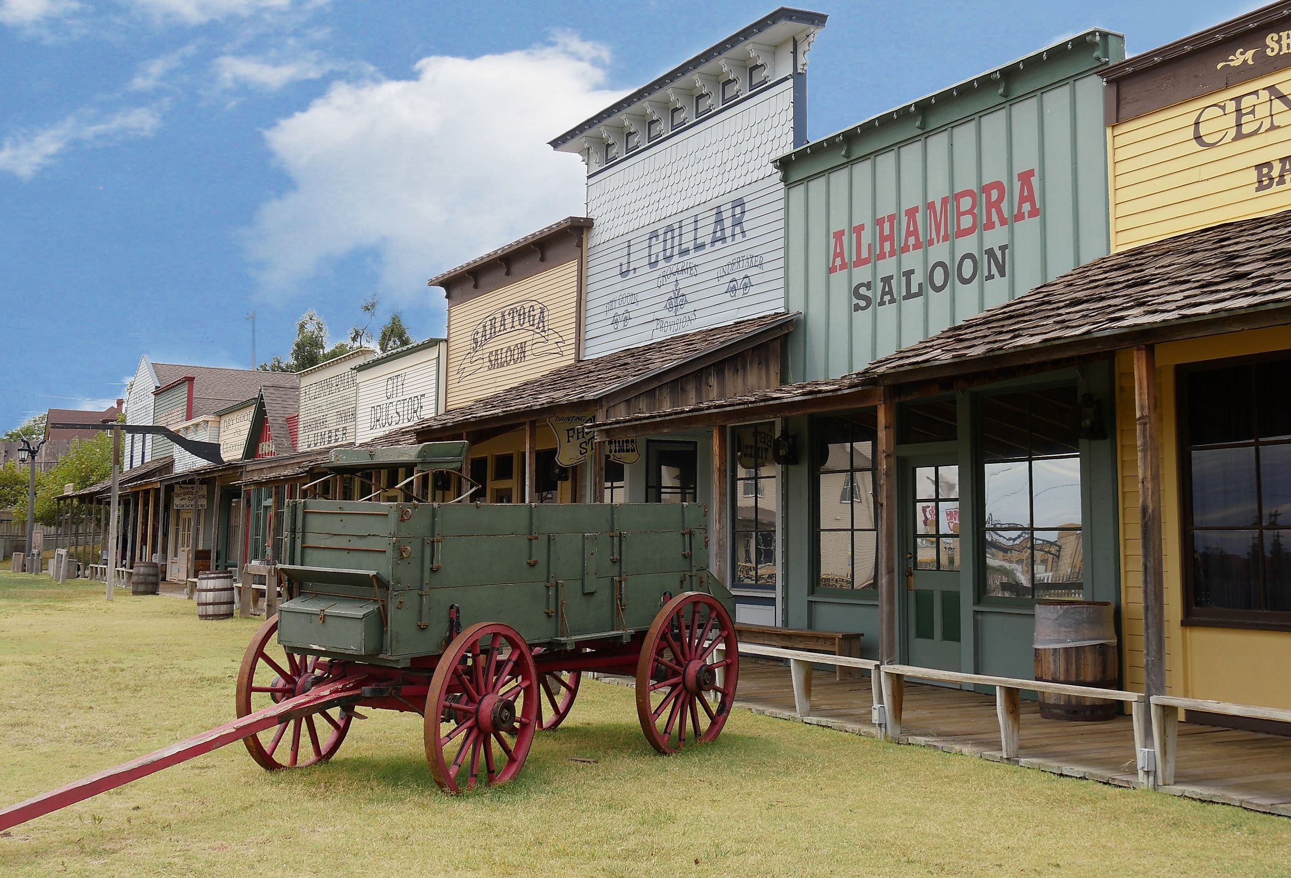 Façade of the Front Street replica with an old chuck wagon at the Boot Hill historical museum in Dodge City, Kansas. Image credit RaksyBH via Shutterstock