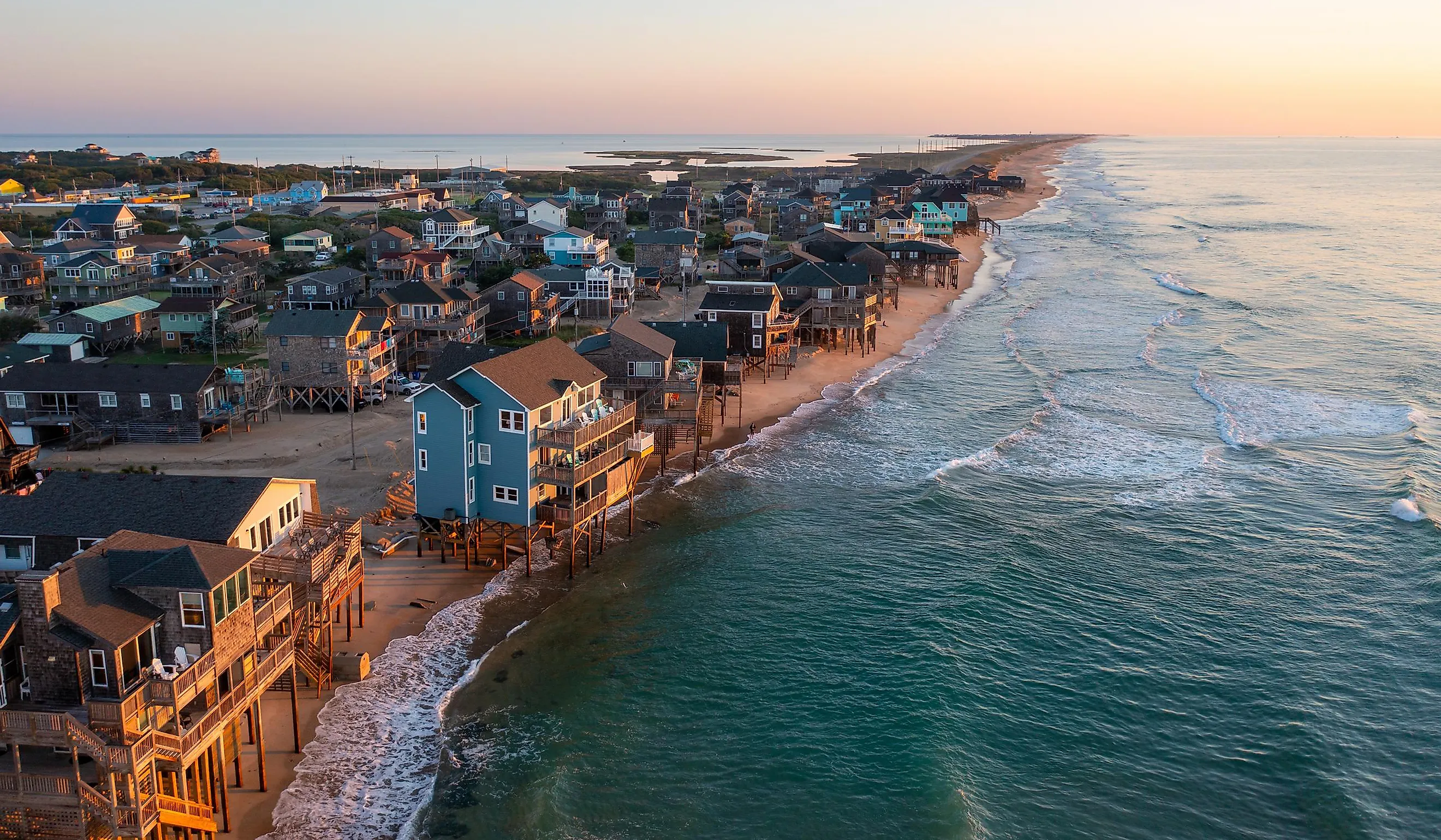 Aerial view of homes right on the shoreline in Buxton, North Carolina.