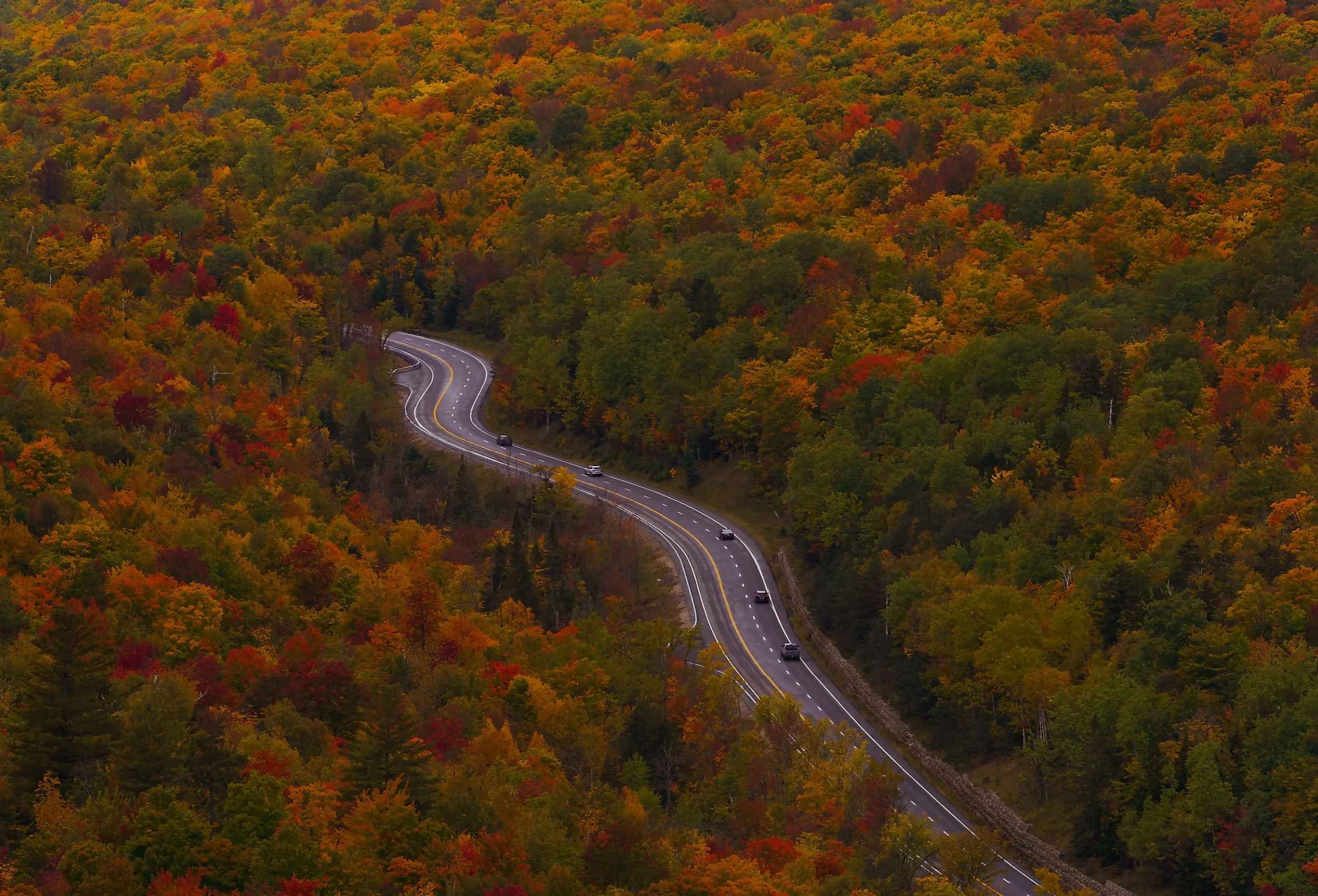 Aerial view of cars driving along scenic byway in the Adirondacks, New York.