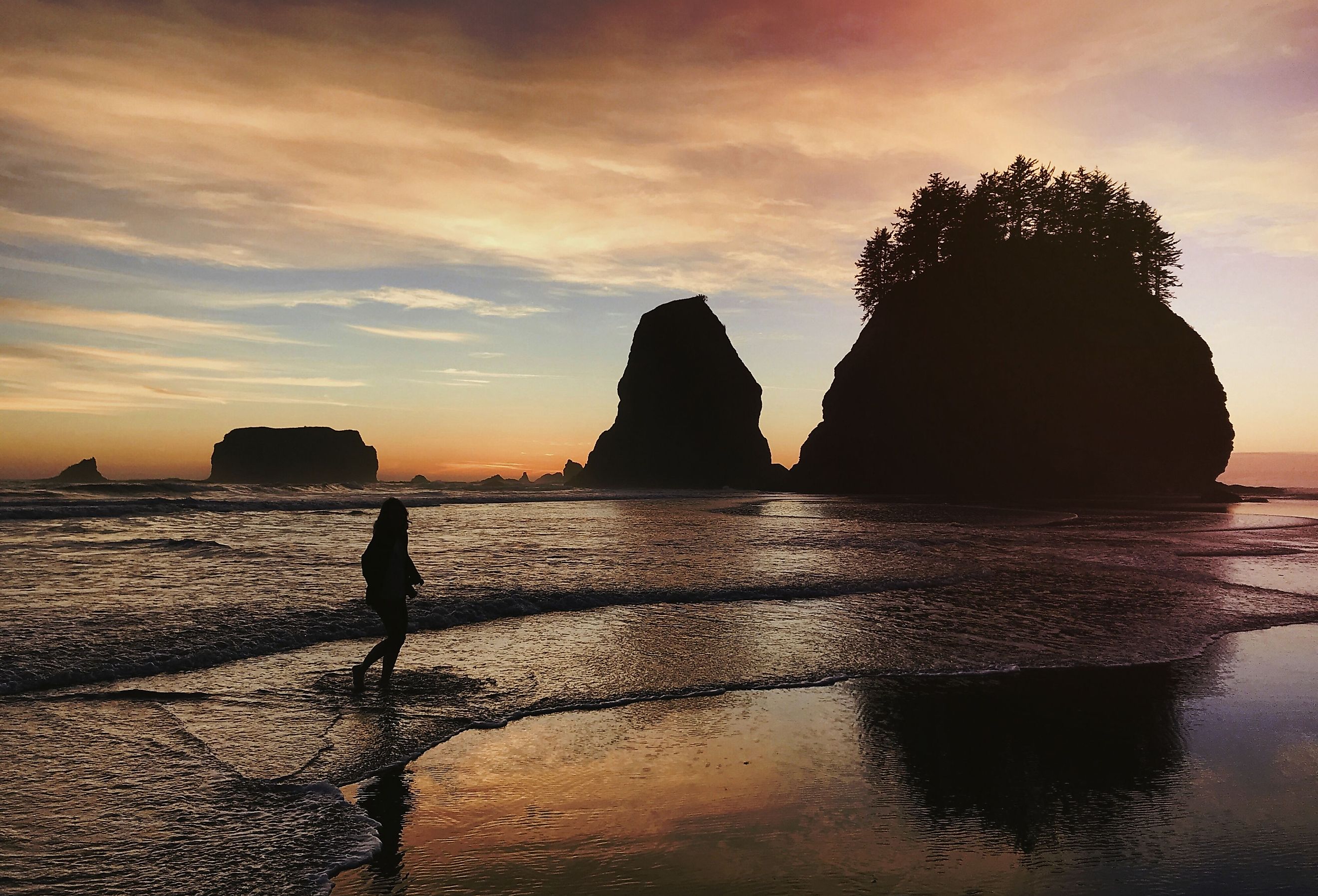 Silhouette of woman on La Push Beach, Washington, United States.