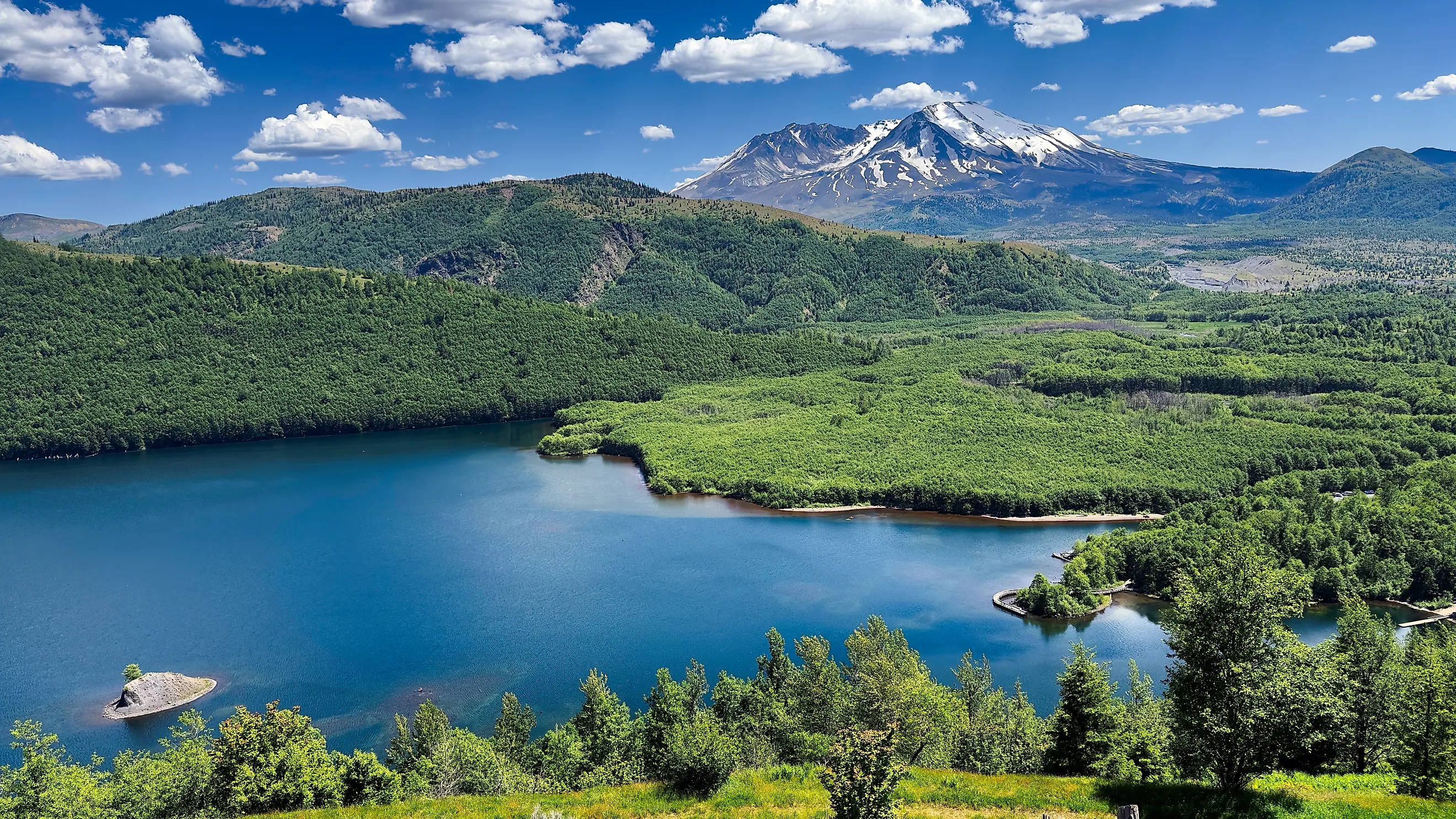 Mount St. Helens looms above Coldwater Lake in southern Washington, a lake that was formed during the 1980 eruption.