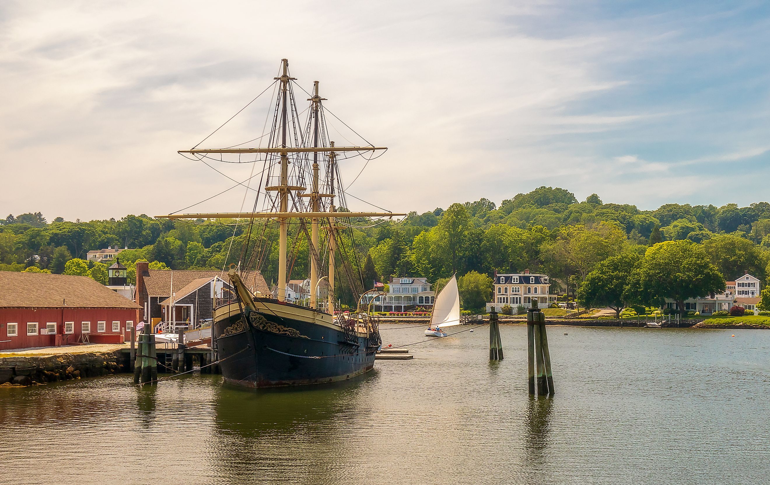 Mystic, Connecticut - June 20, 2020: Mystic Seaport, outdoor recreated 19th century village and educational maritime museum in Mystic, Connecticut. Wooden vessel docks. Editorial credit: Faina Gurevich / Shutterstock.com