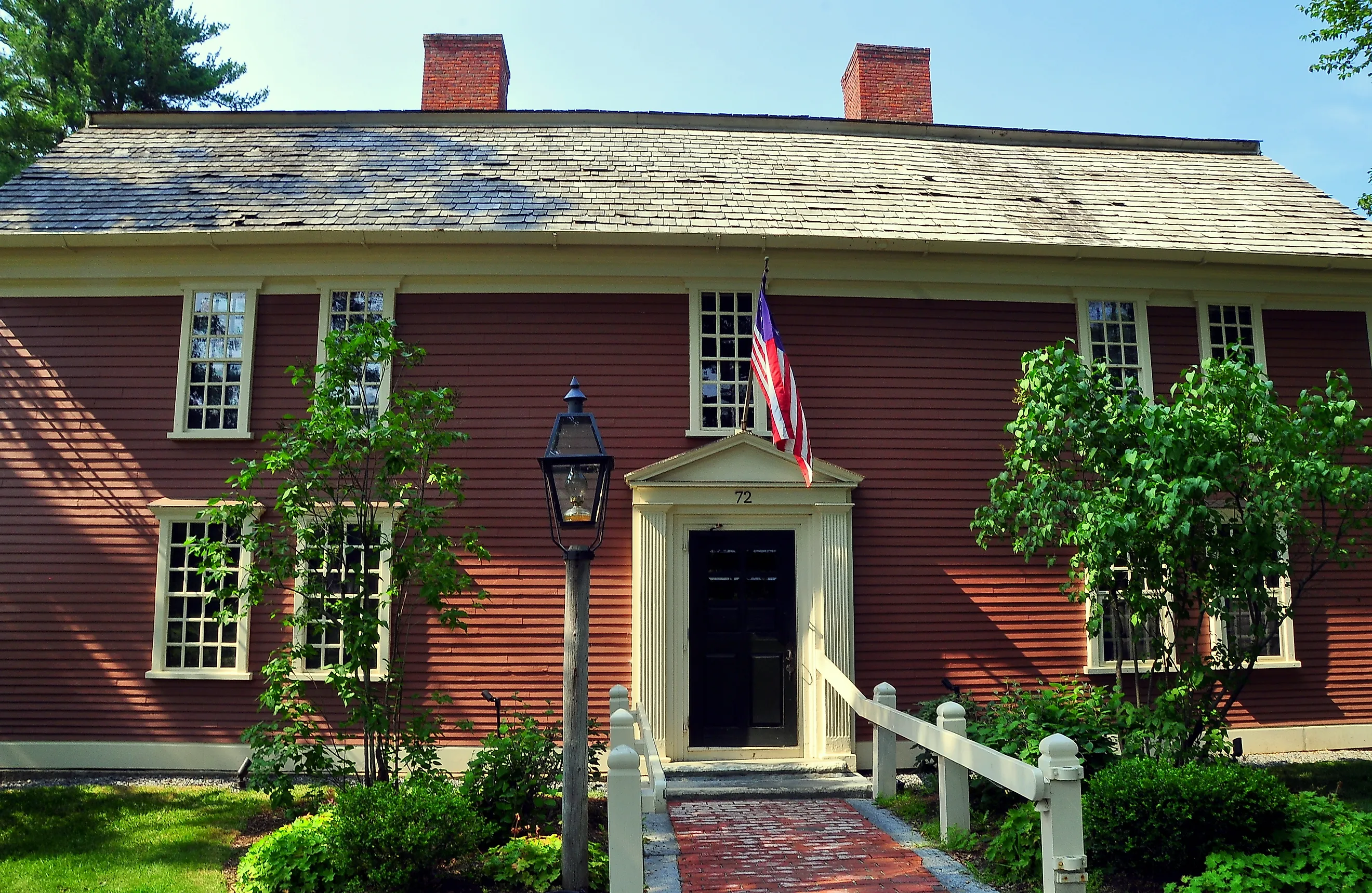 The Colonial-era 1716 Wayside Inn, immortalised by Henry Wadsworth Longfellow in "Tales of the Wayside Inn", still provides lodging and fine dining to travelers as the oldest hotel still running in America. Editorial credit: LEE SNIDER PHOTO IMAGES / Shut