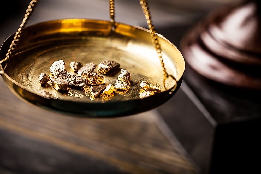 Gold nuggets on a scale.