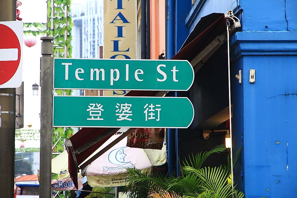 A bilingual street sign in Singapore. Editorial credit: Simon Poon / Shutterstock.com.
