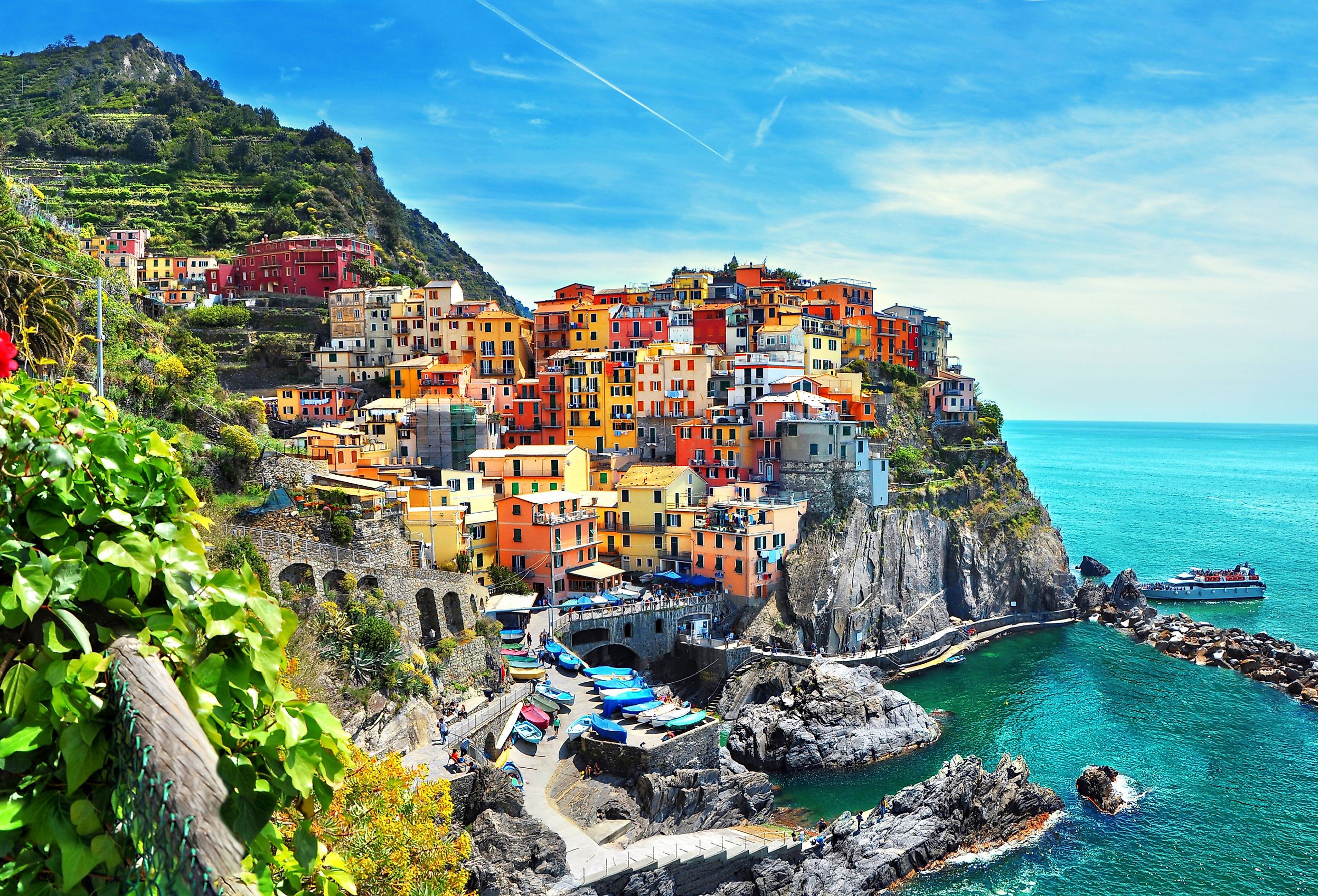 Beautiful view of Manarola town, one of five famous colorful villages of Cinque Terre in Italy. Image credit: Minoli via Shutterstock 