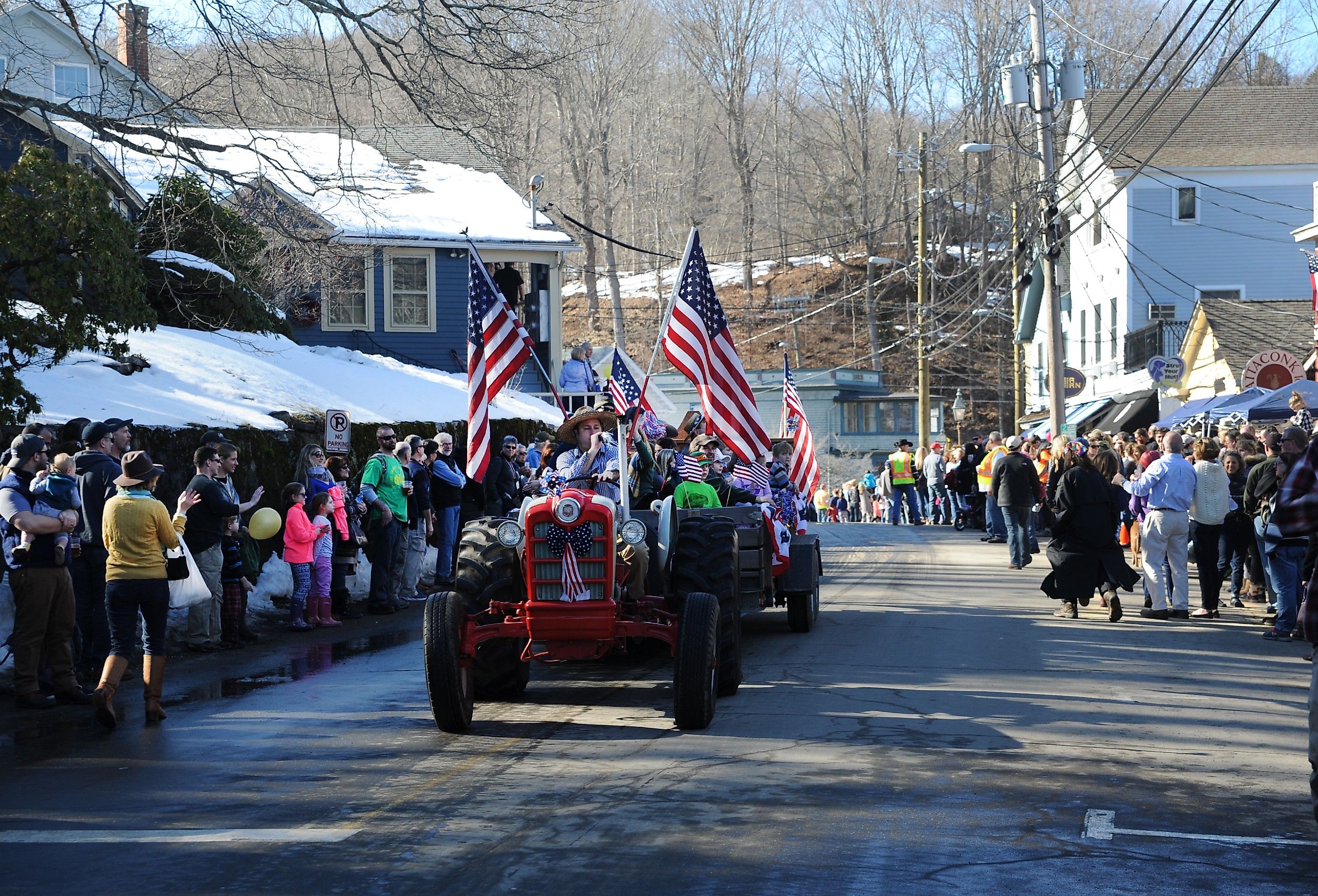 A tractor parade makes it's way through Chester, Connecticut during a winter festival. Image credit Joe Tabacca via Shutterstock