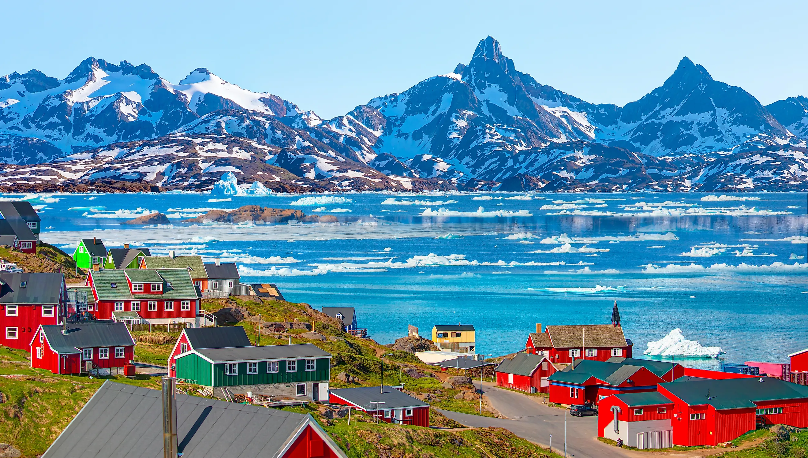Picturesque village on coast of Greenland - Colorful houses in Tasiilaq, East Greenland