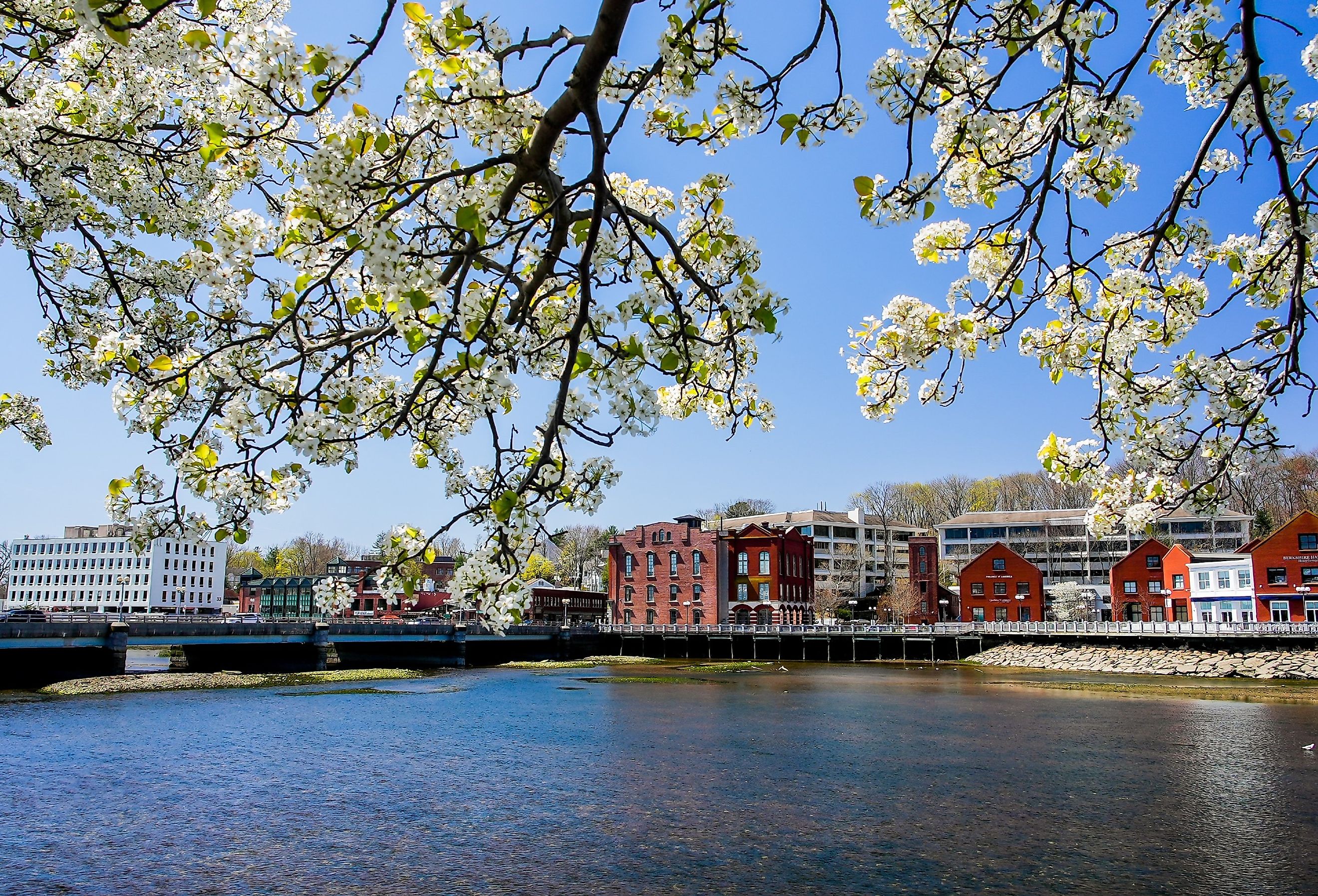 View from Westport Bridge over Saugatuck River and architecture near downtown in Westport, Connecticut. Image credit Miro Vrlik Photography via Shutterstock