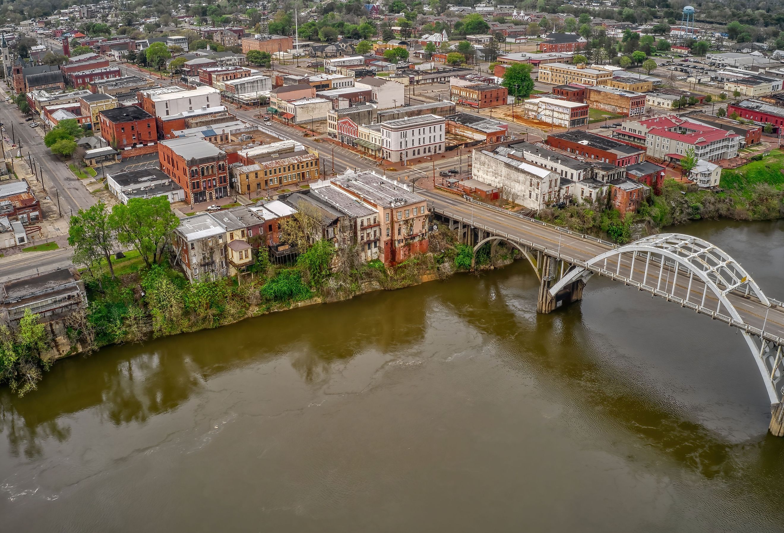 Overlooking Selma, Alabama, showcasing the town's historic architecture, streets, and the iconic bridge spanning over the river.