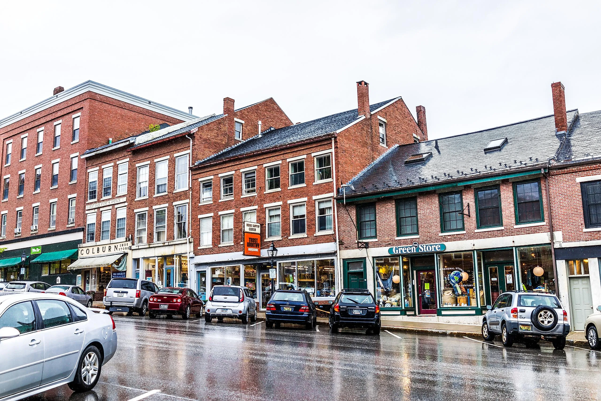 Brick buildings lined along the steep main street in Belfast, Maine. Image credit Kristi Blokhin via Shutterstock