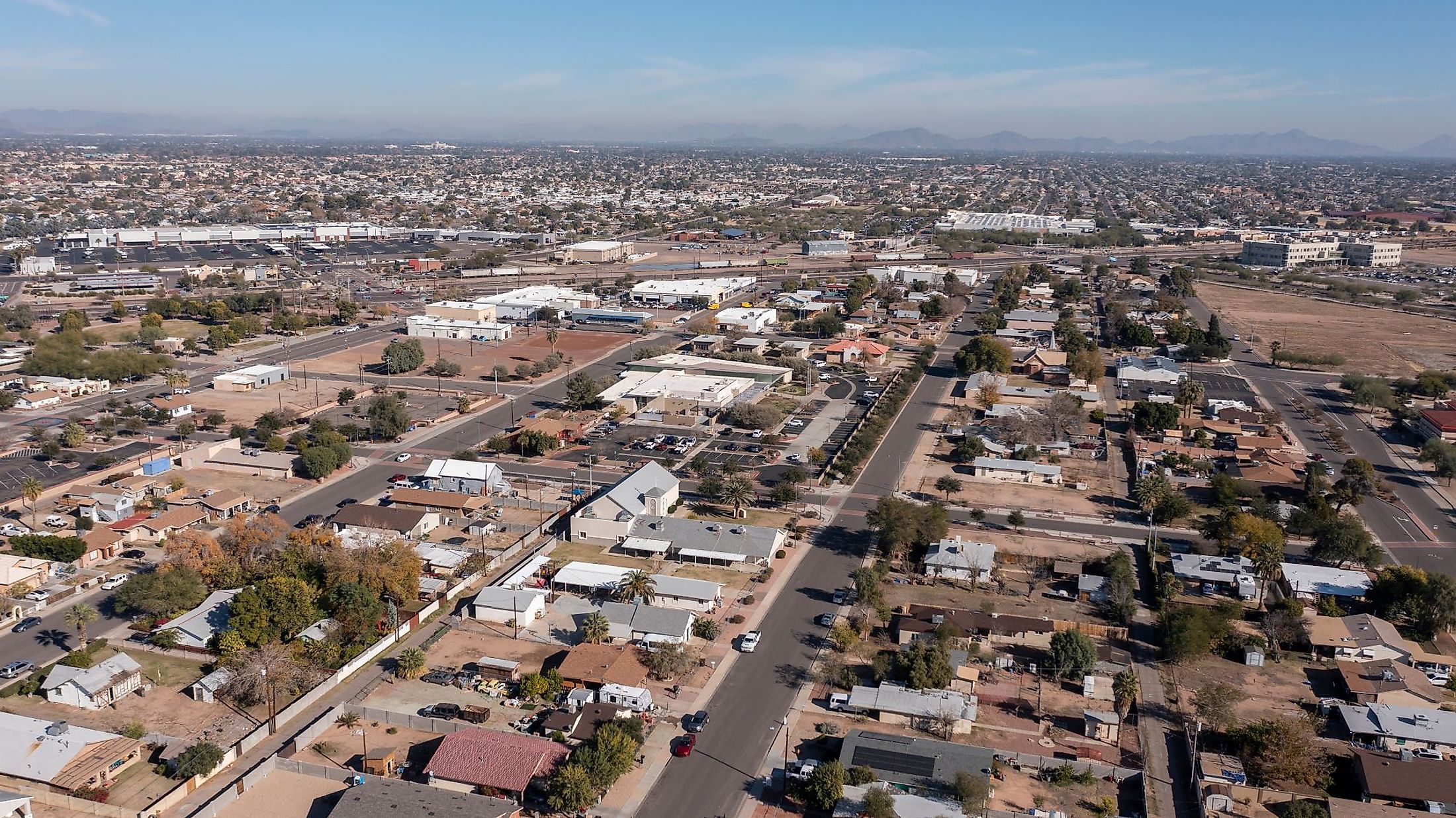 Afternoon aerial view of the downtown skyline and surrounding housing of Peoria, Arizona