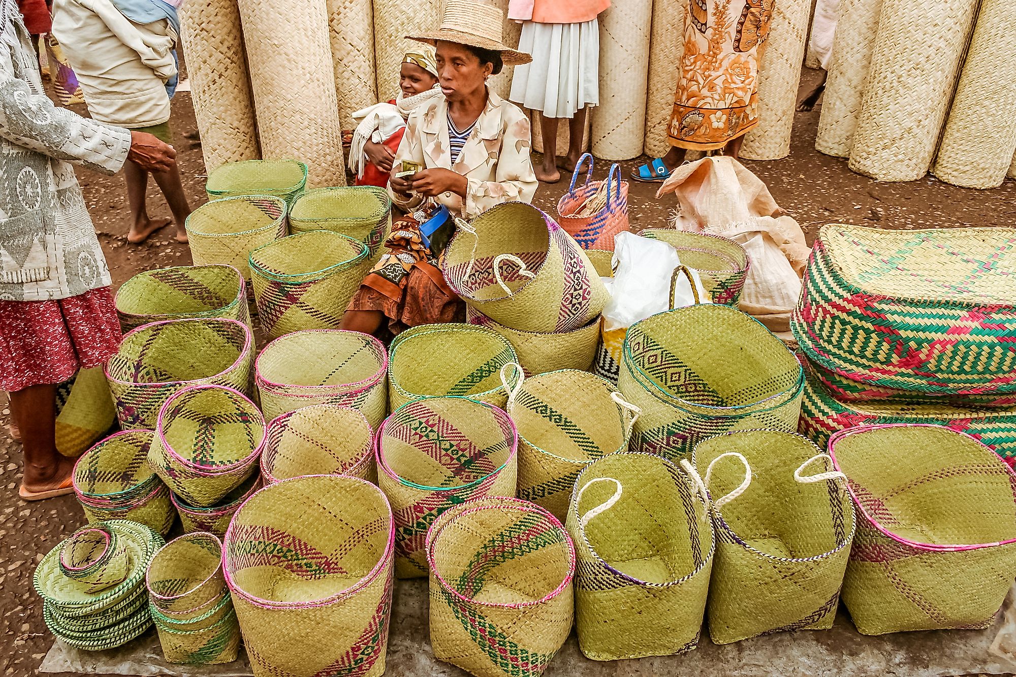 A woman basket seller in the market of Fianarantsoa, Madagascar highlands. Image credit: Pierre-Yves Babelon/Shutterstock.com