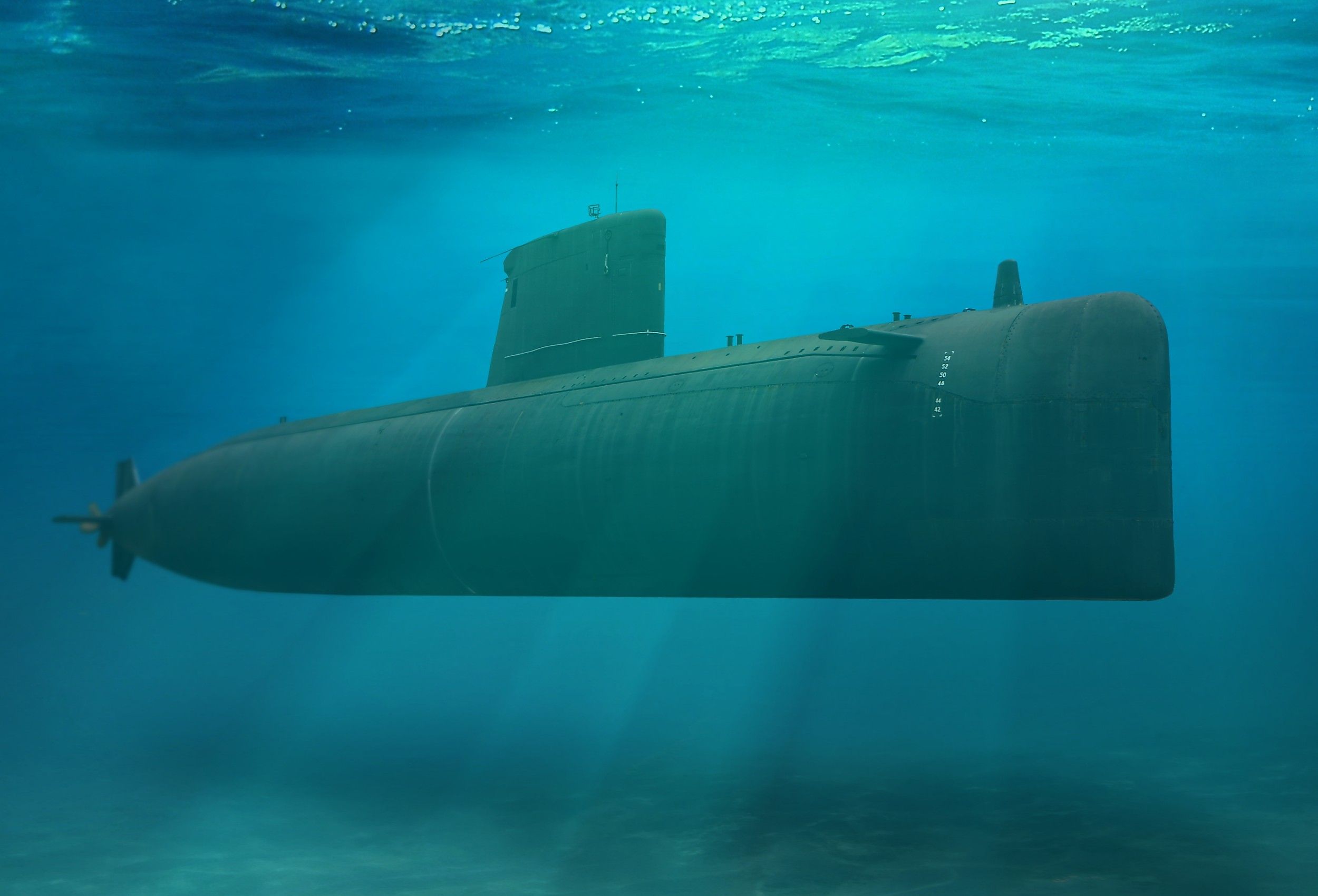 Naval submarine submerged deep underwater. Image credit: noraismail/Shutterstock