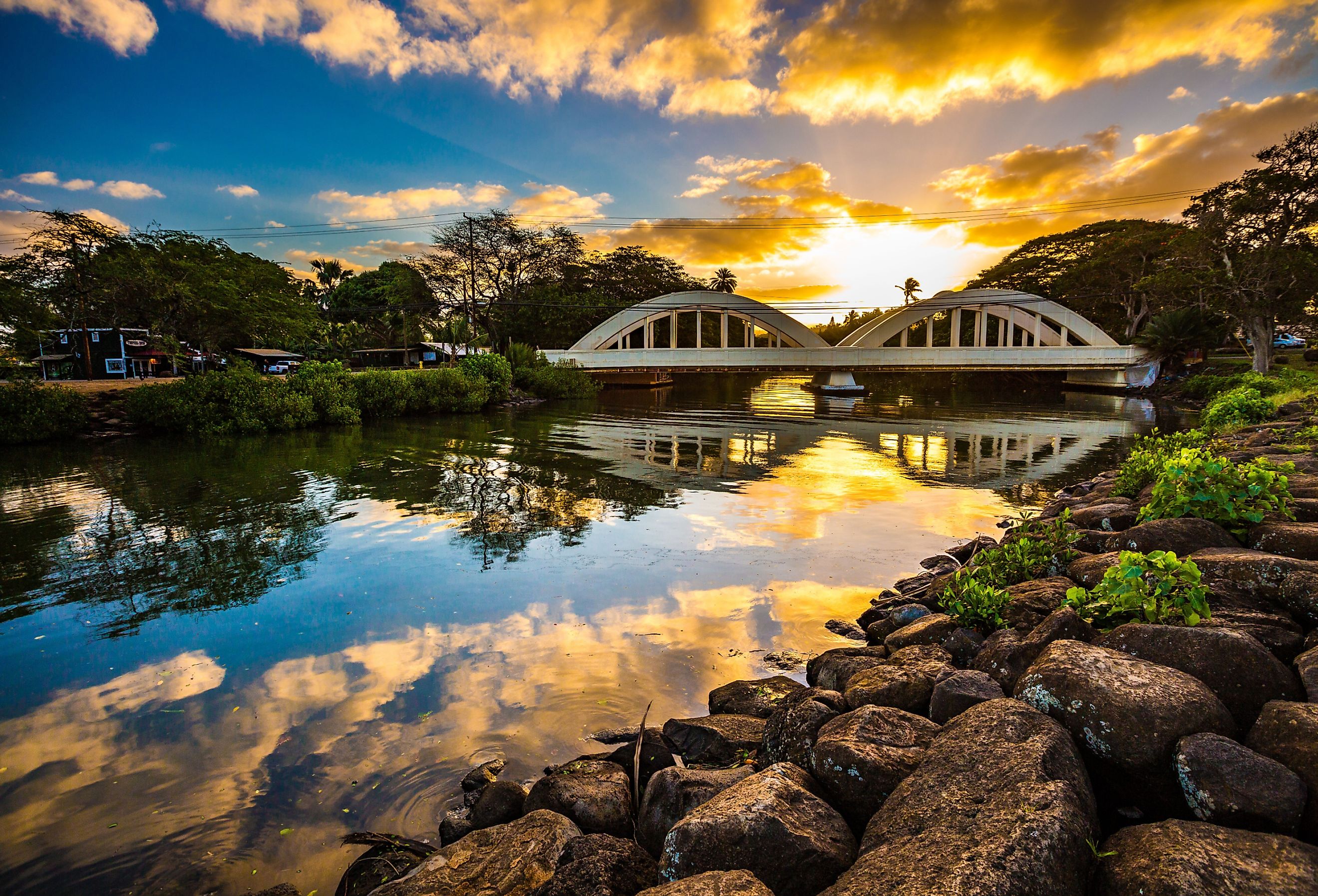 Sunrise over the Anahulu Stream Bridge in Haleiwa, Oahu, Hawaii. Image credit Shane Myers Photography via Shutterstock.