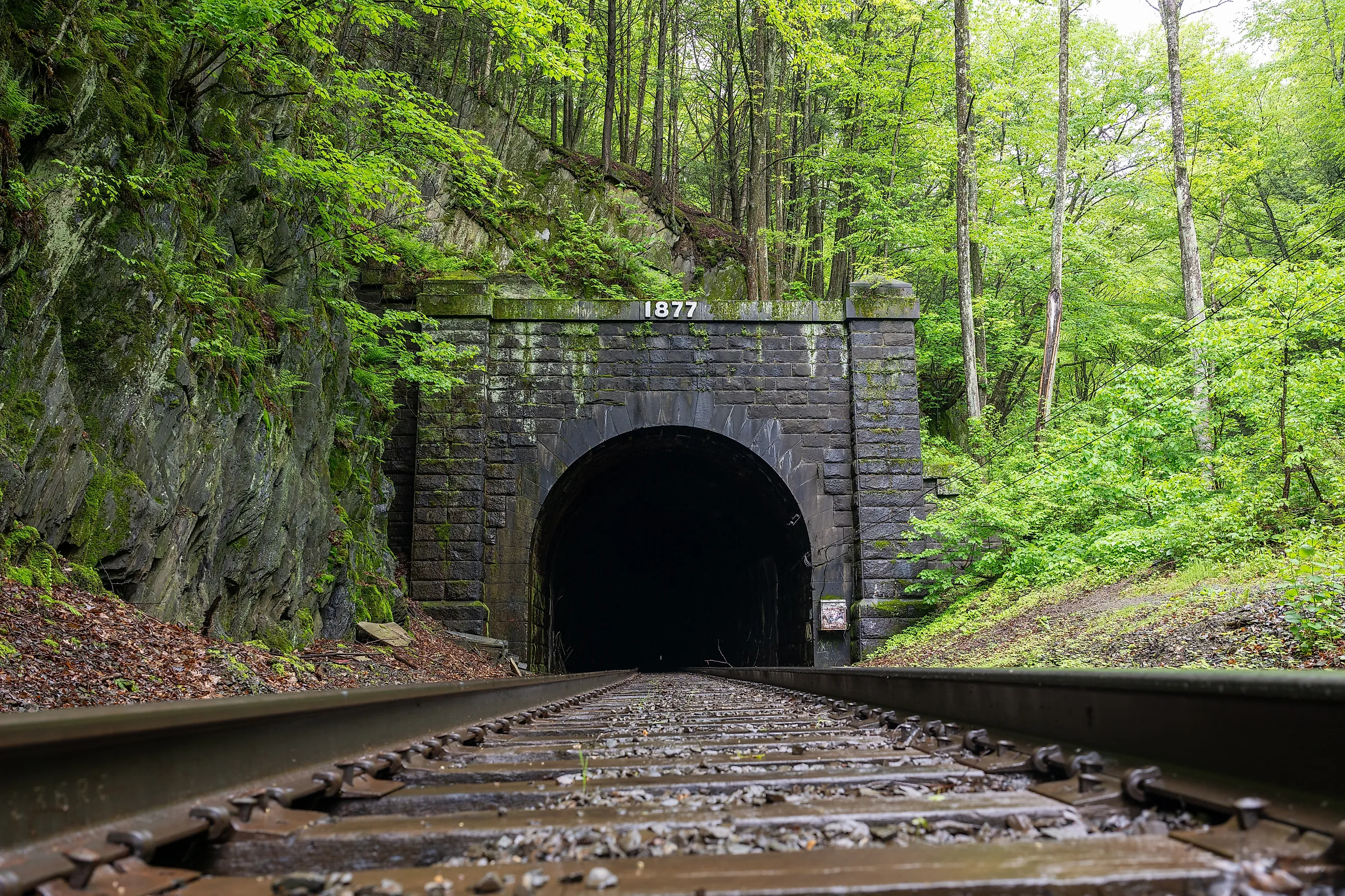 East Portal of the historic Hoosac Tunnel near North Adams, MA—an iconic 19th-century railroad tunnel framed by rugged stone and forested Berkshire scenery.