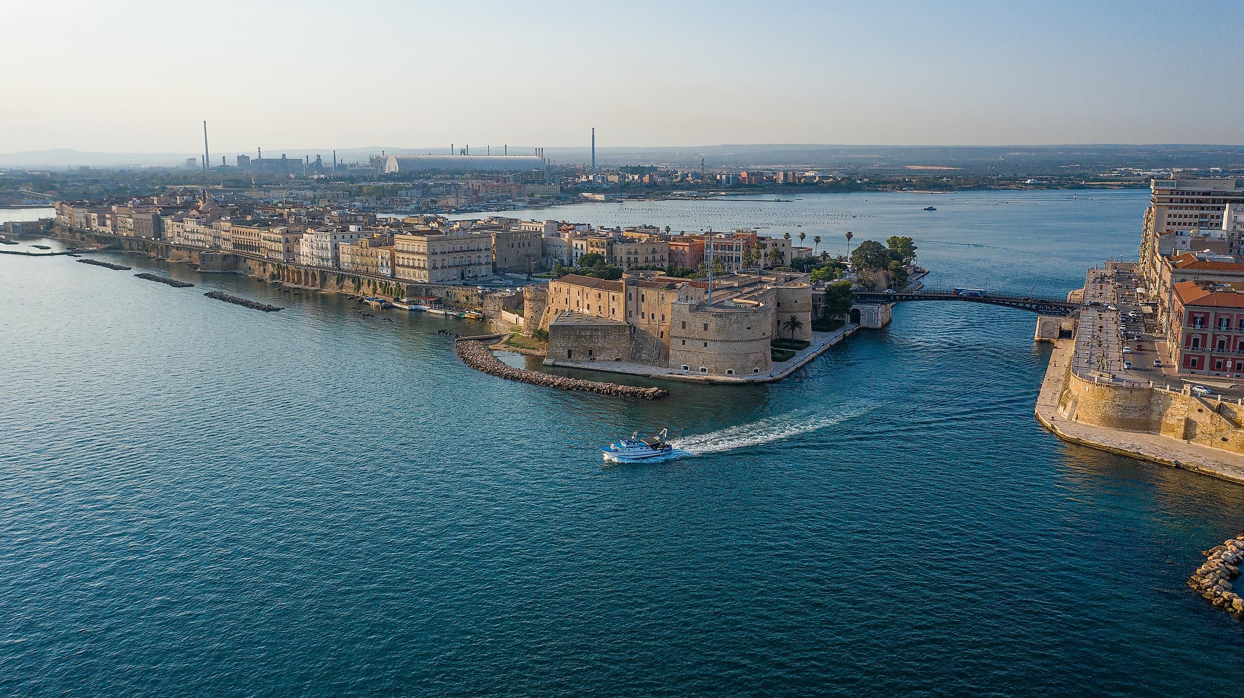 The Gulf Of Taranto with the Old medieval Aragonese Castle on sea channel.