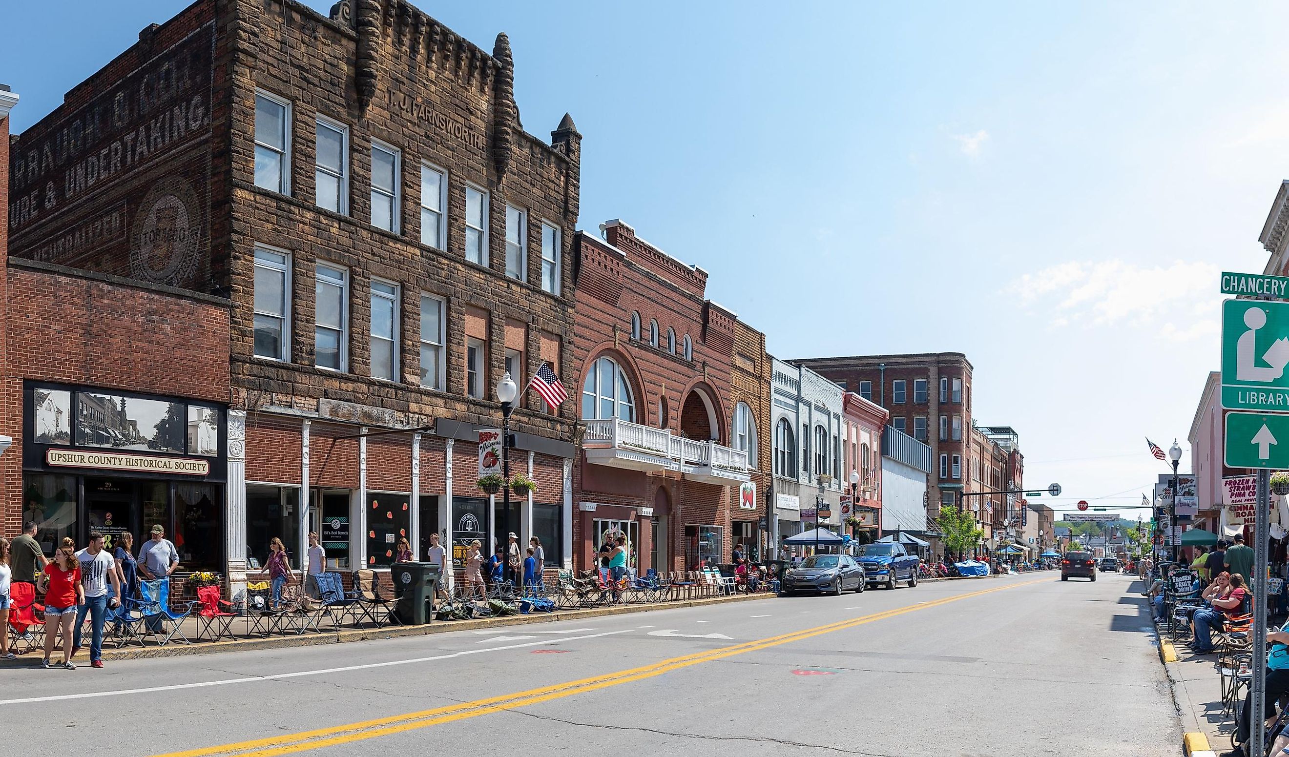 Buckhannon, West Virginia, USA - May 18, 2019: The Historic Building along Main Street, with locals and tourist walking along, waiting for the parade