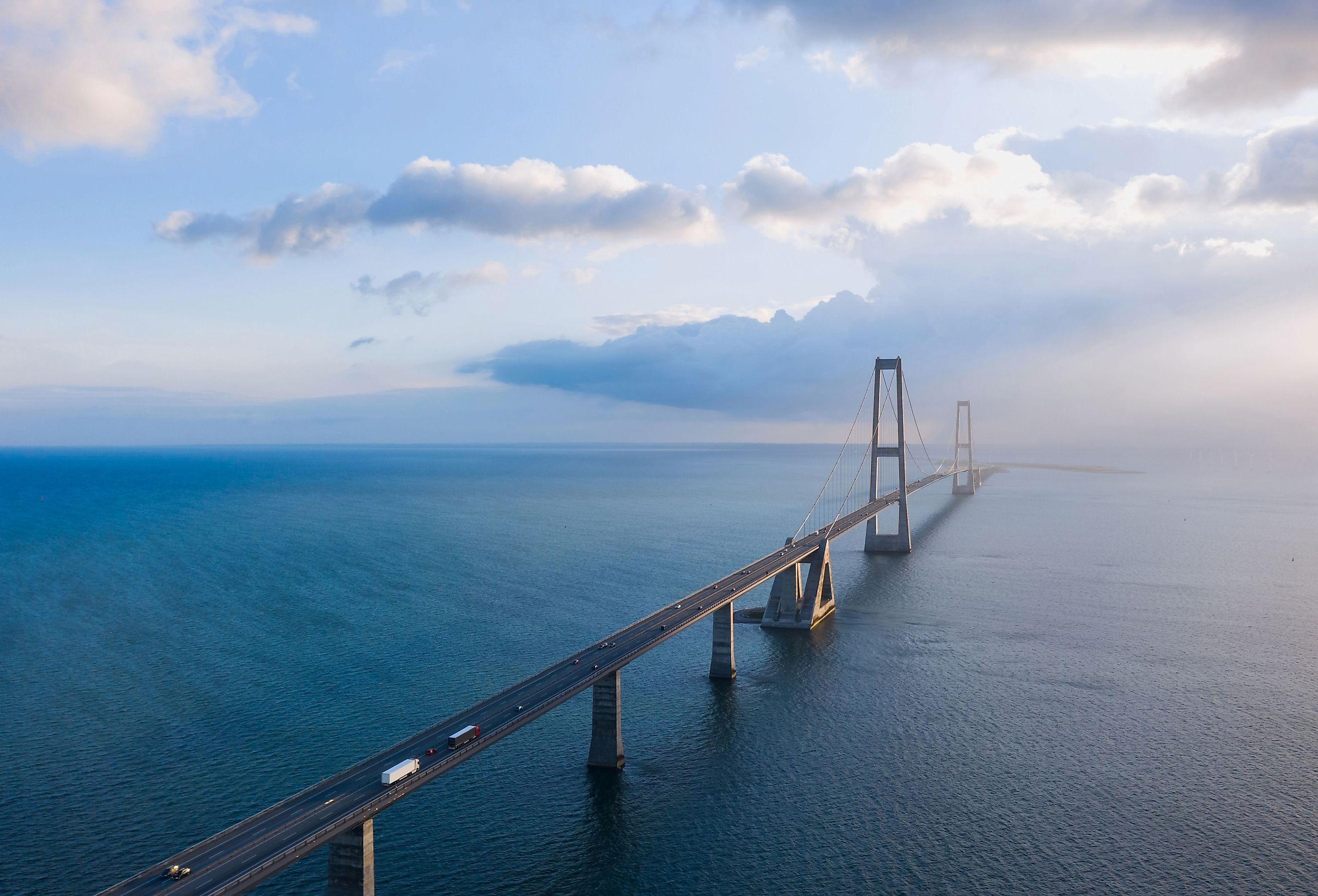 The famous Great Belt bridge (Østbroen) in Denmark, a multi-element fixed link crossing the Great Belt strait between the Danish islands of Zealand and Funen. Image credit uslatar via Shutterstock.