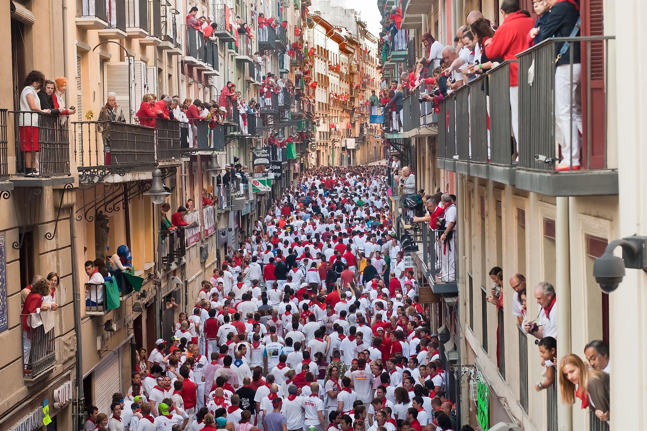 Calle Estafeta is packed with people dressed in white and red, waiting for the morning bull run to kick off. Part of the annual San Fermin Festival. Photo: Migel