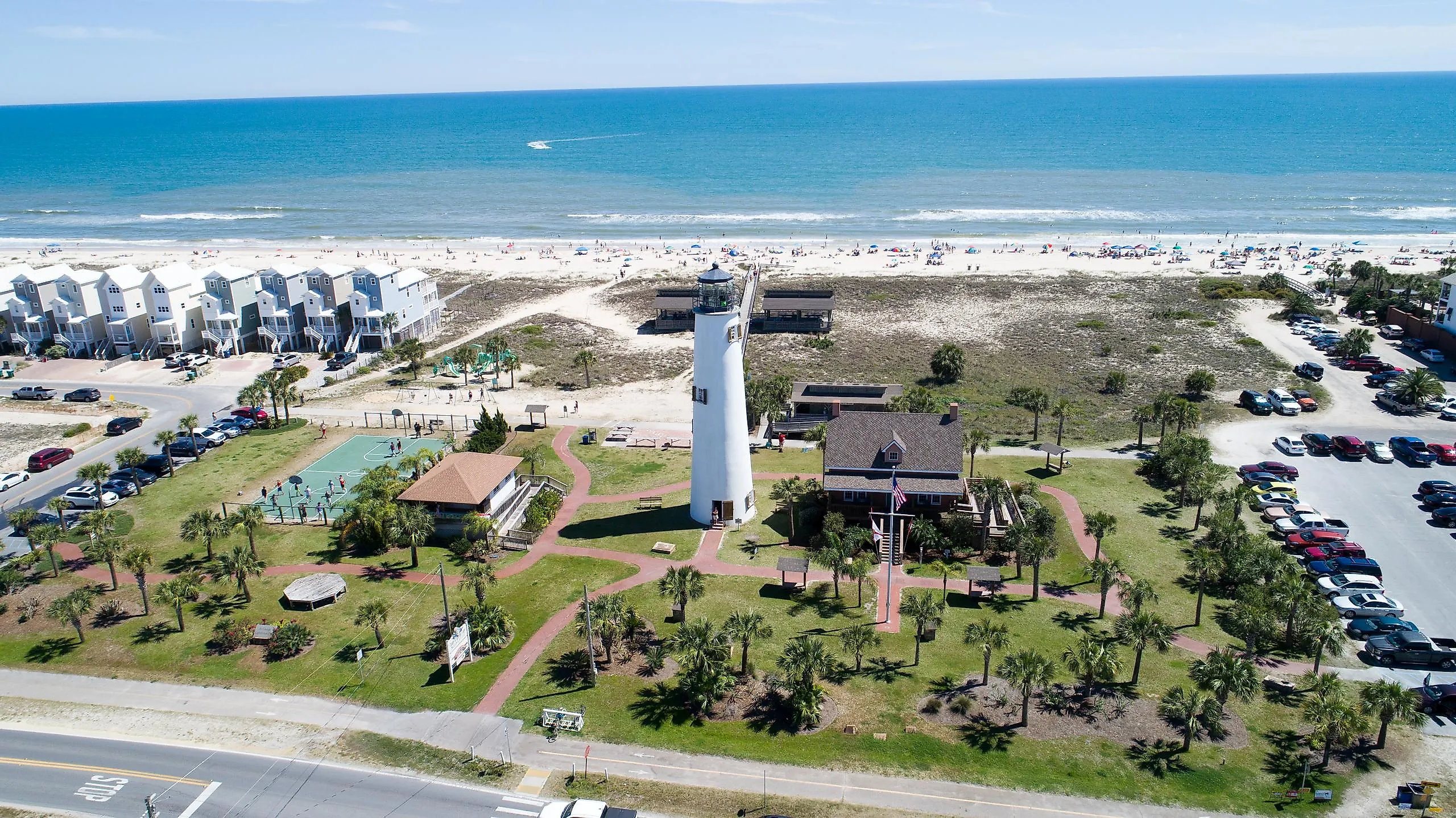 The beautiful coastline with beachside homes and a lighthouse at St. George Island.