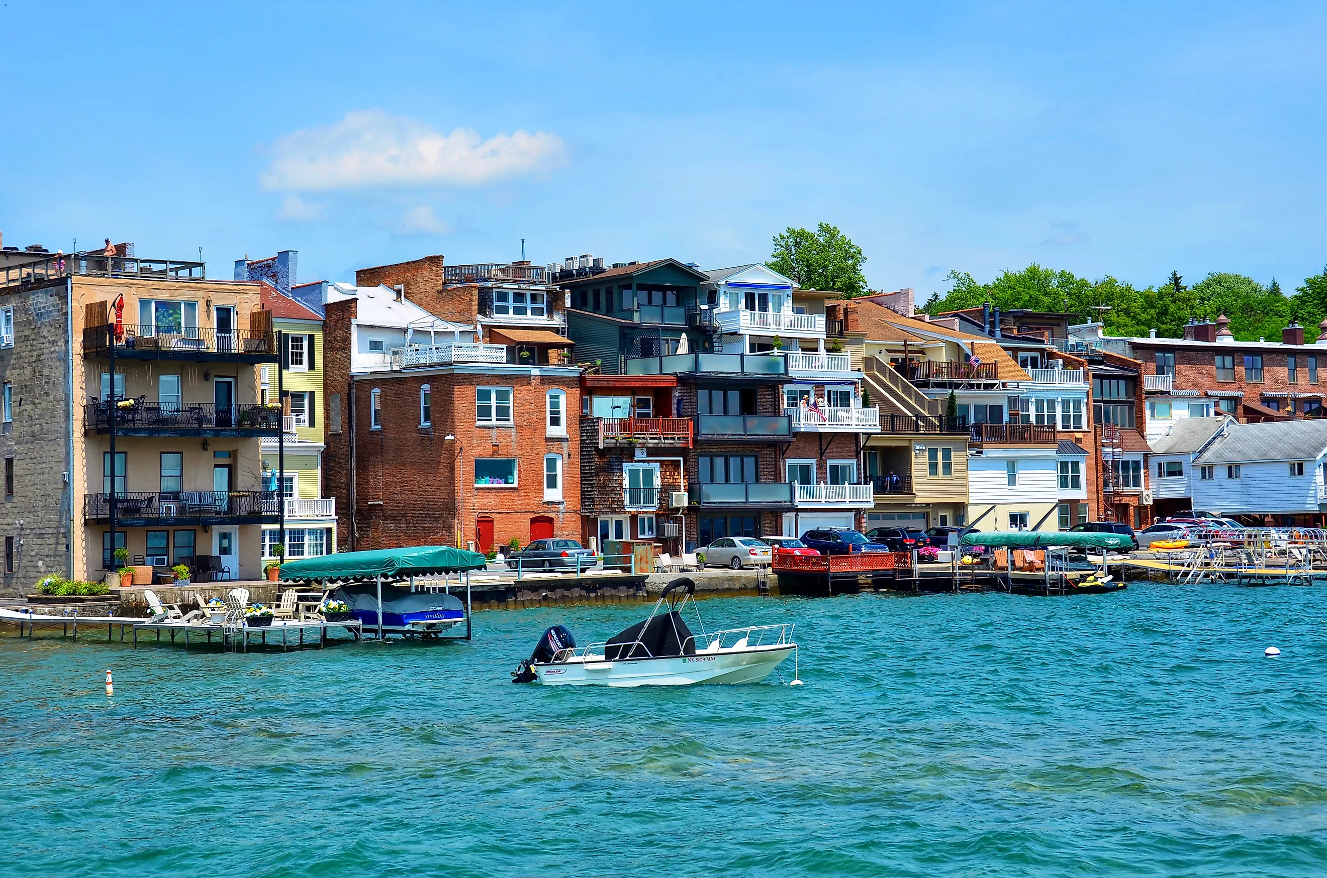 Lakefront buildings and boats along the coast of Lake Skaneateles in New York. Editorial credit: PQK / Shutterstock.com
