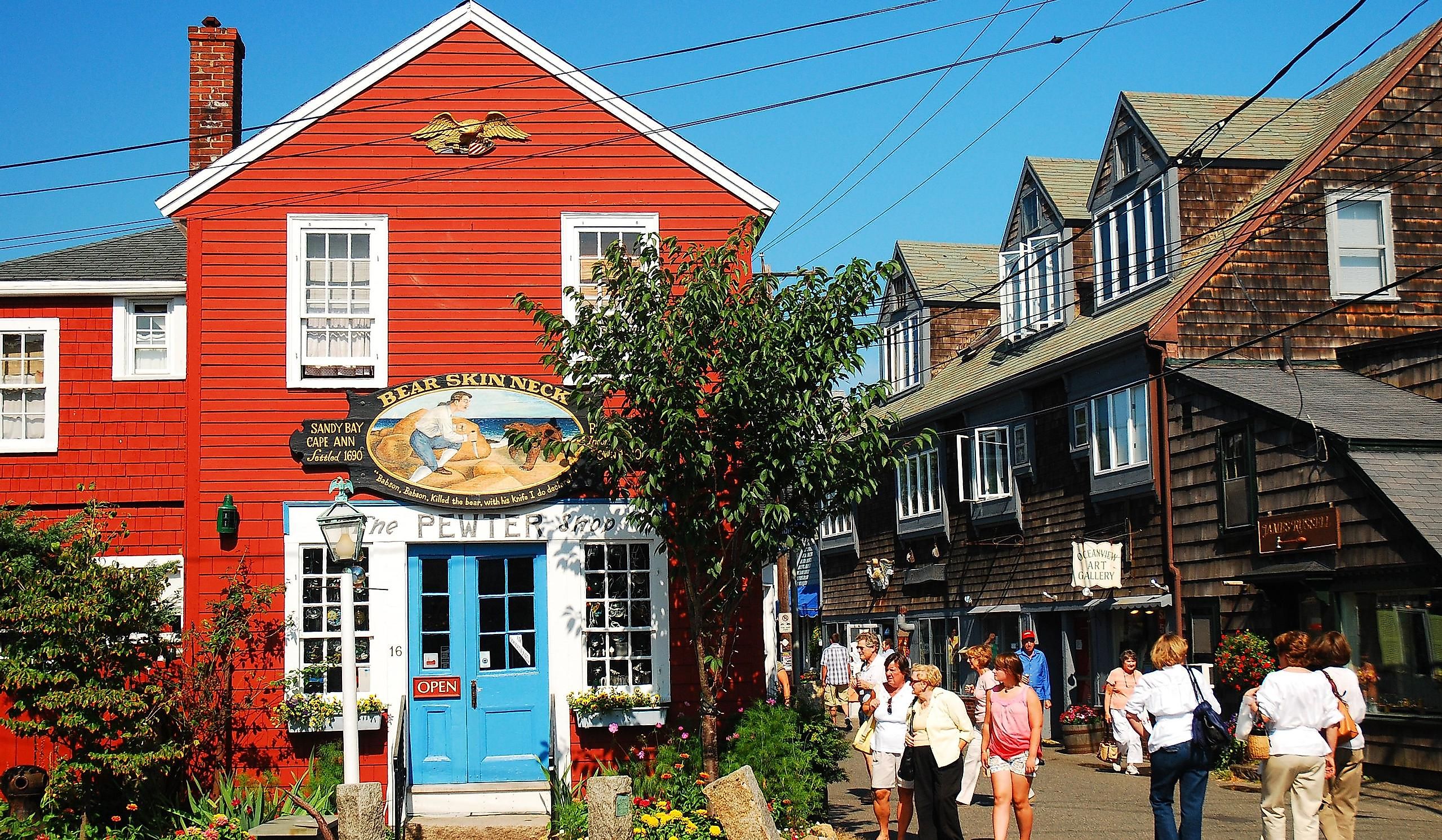 Folks stroll around the unique shops and boutiques on Bearskin Neck in Rockport, Massachusetts. Editorial credit: James Kirkikis / Shutterstock.com