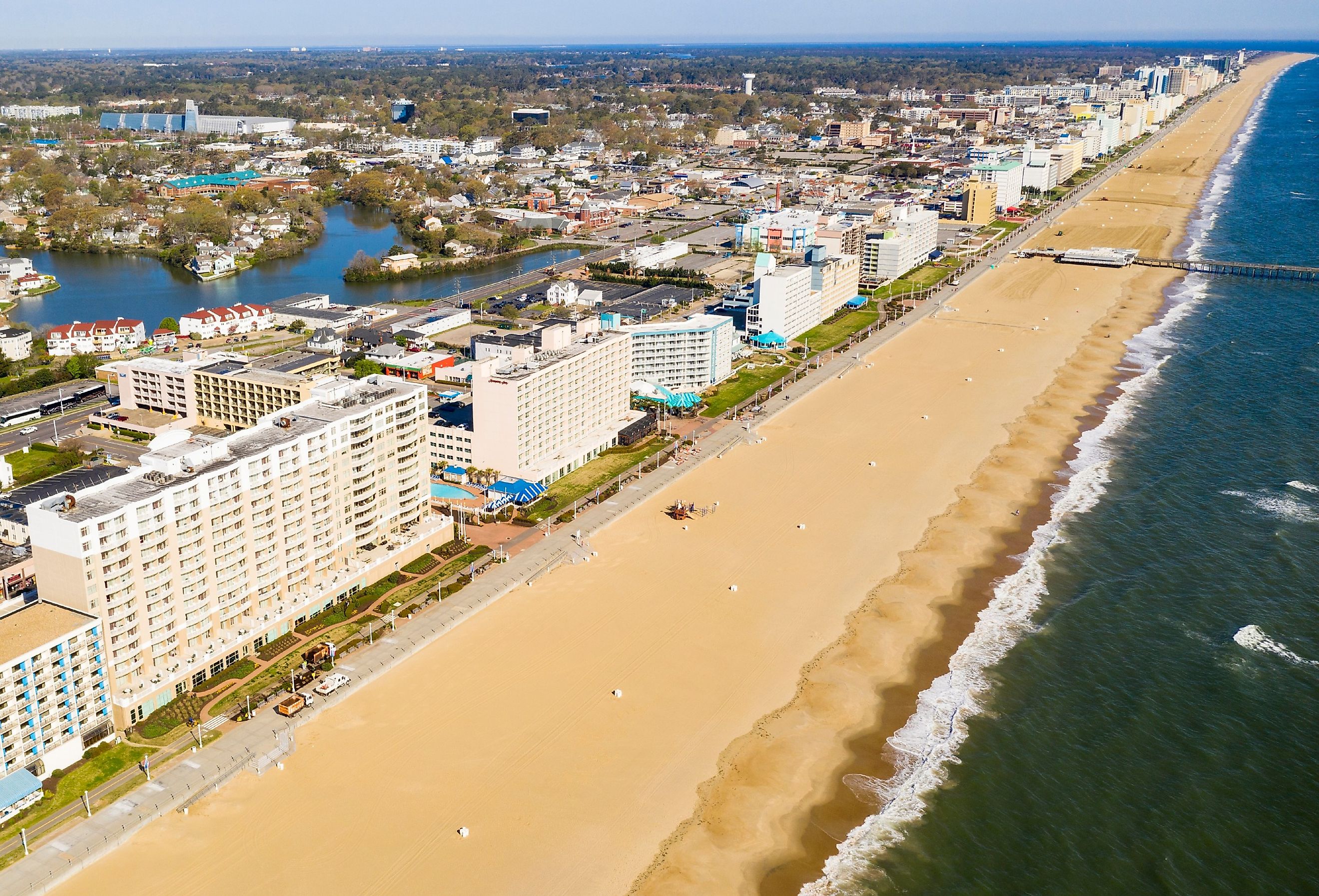 High aerial view of a long row of hotels along the Atlantic Ocean beach in Maryland.