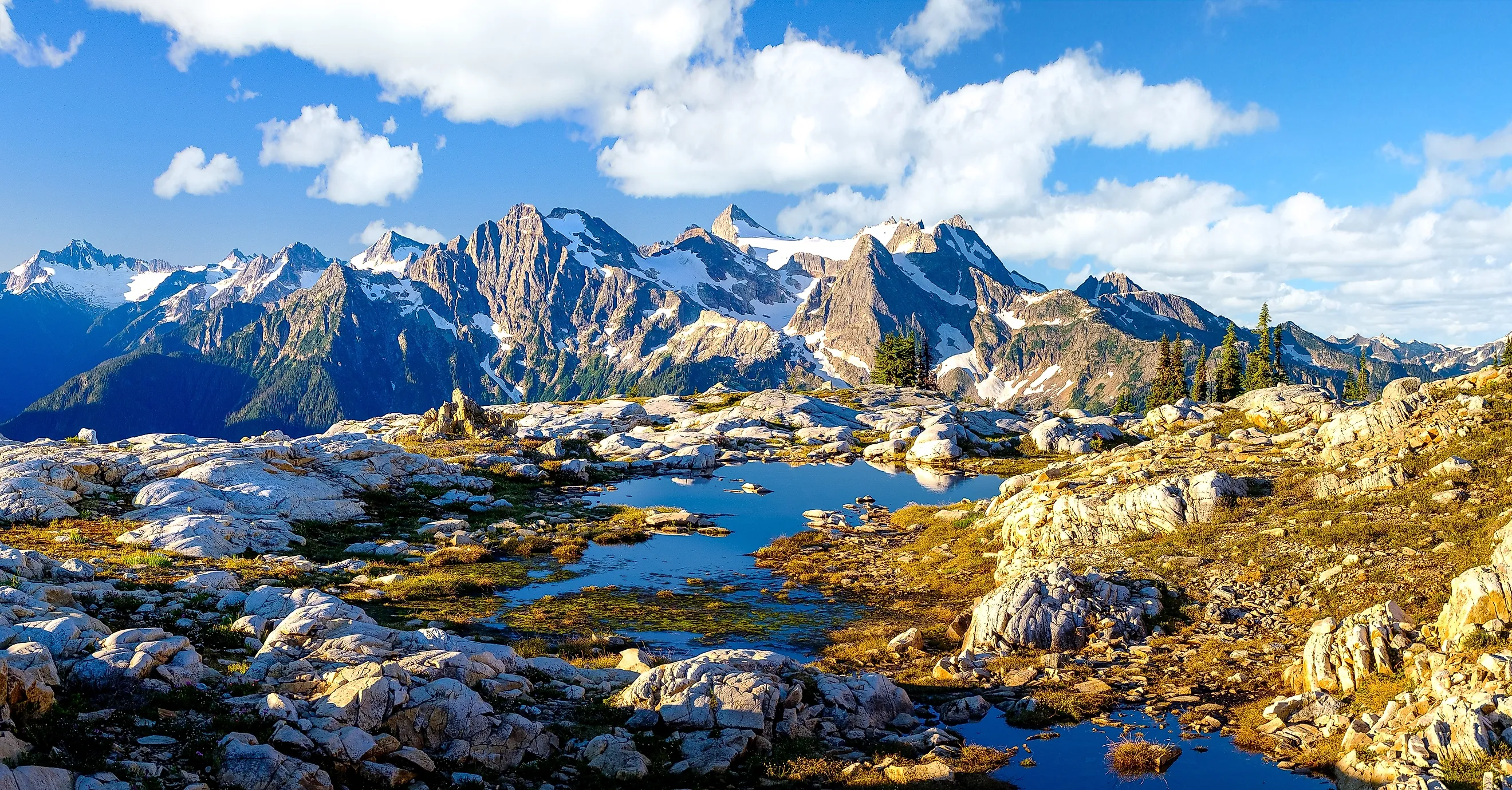 Sunrise Illuminates Beautiful Mountains and Ponds In North Cascades National Park, Washington.