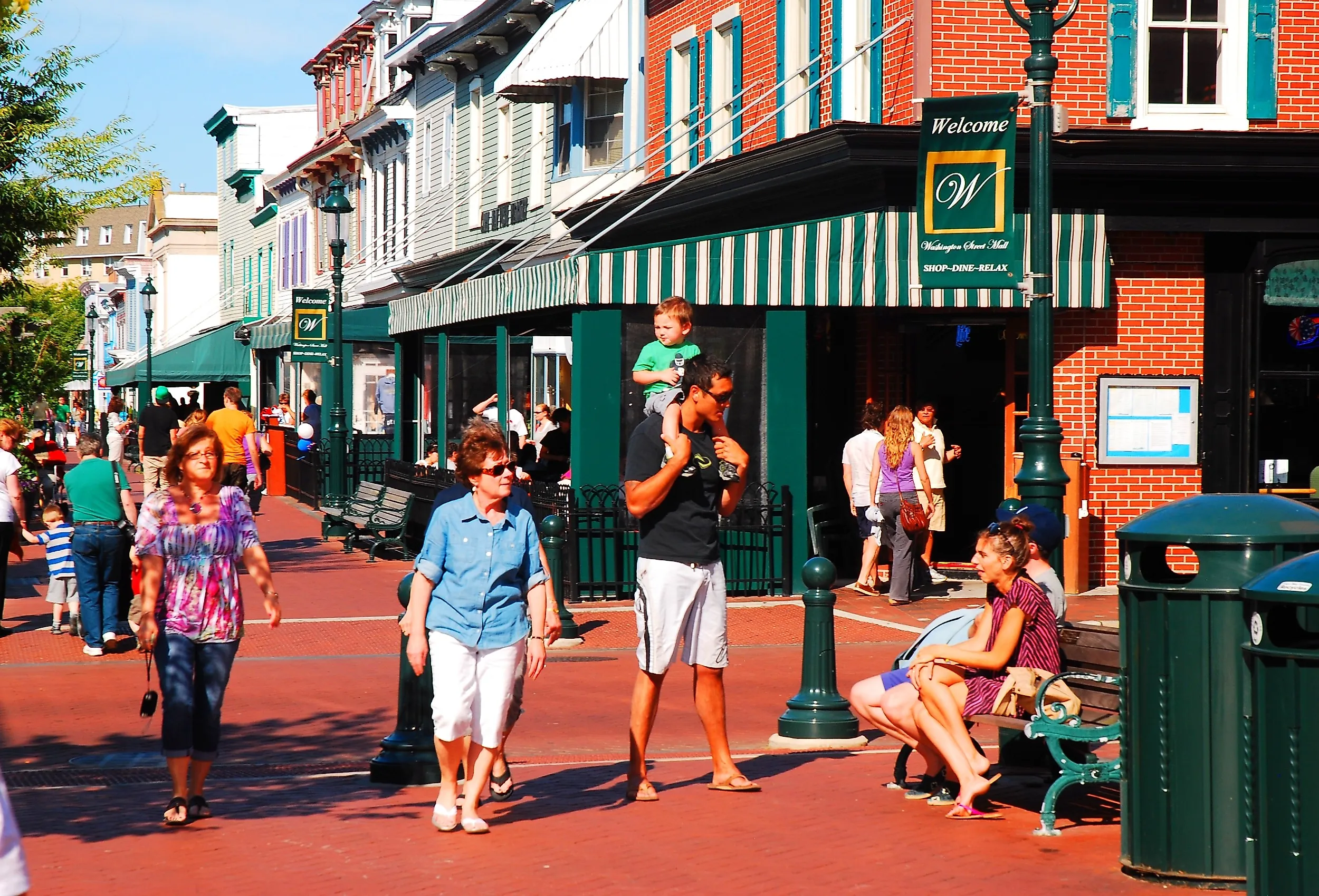People walk around Washington Street Mall and shopping area in Cape May, New Jersey. Image credit James Kirkikis via Shutterstock