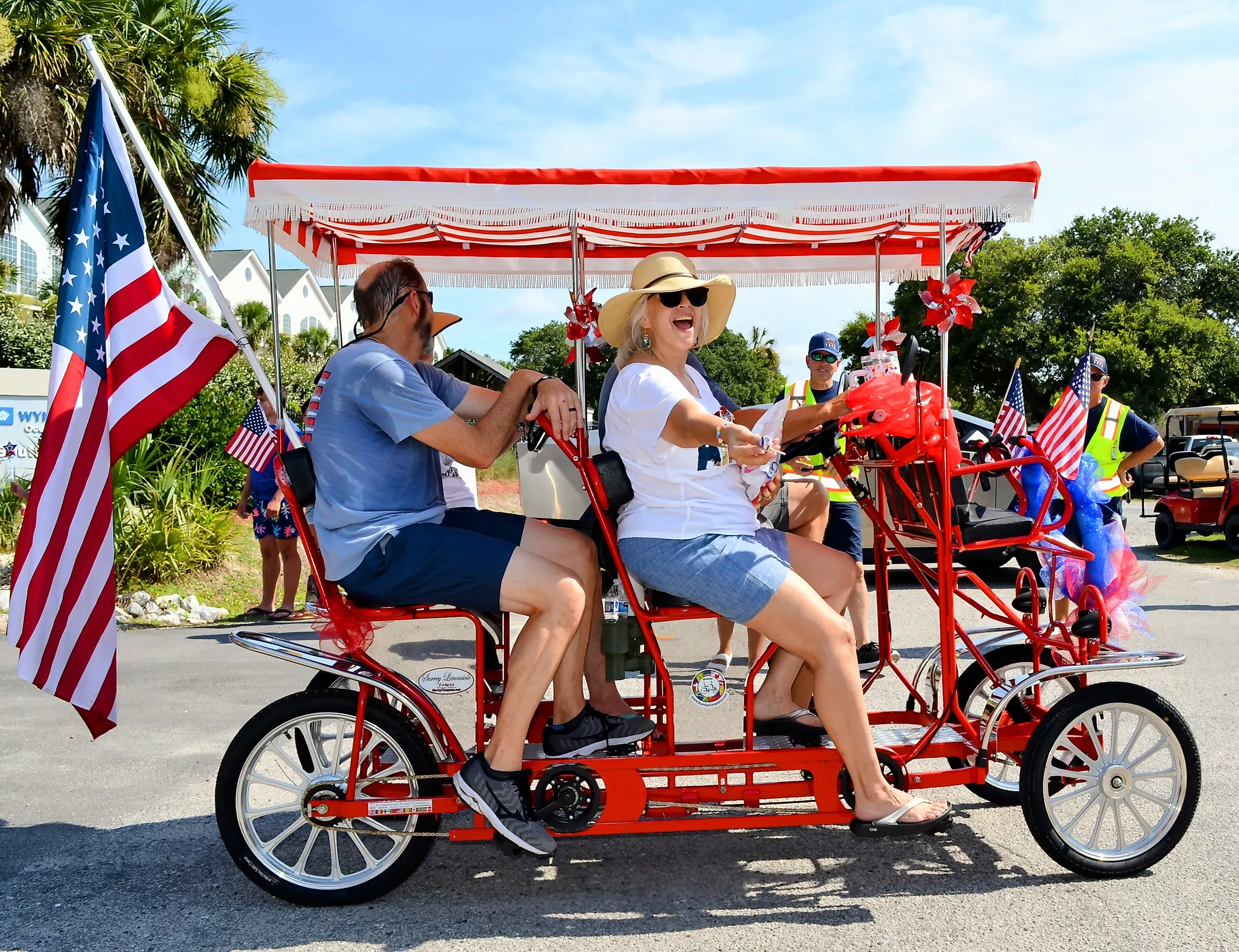 Surrey Bike with an American Flag in a Fourth of July Parade on Edisto Beach. Editorial credit: Coastal Soul Photography / Shutterstock.com