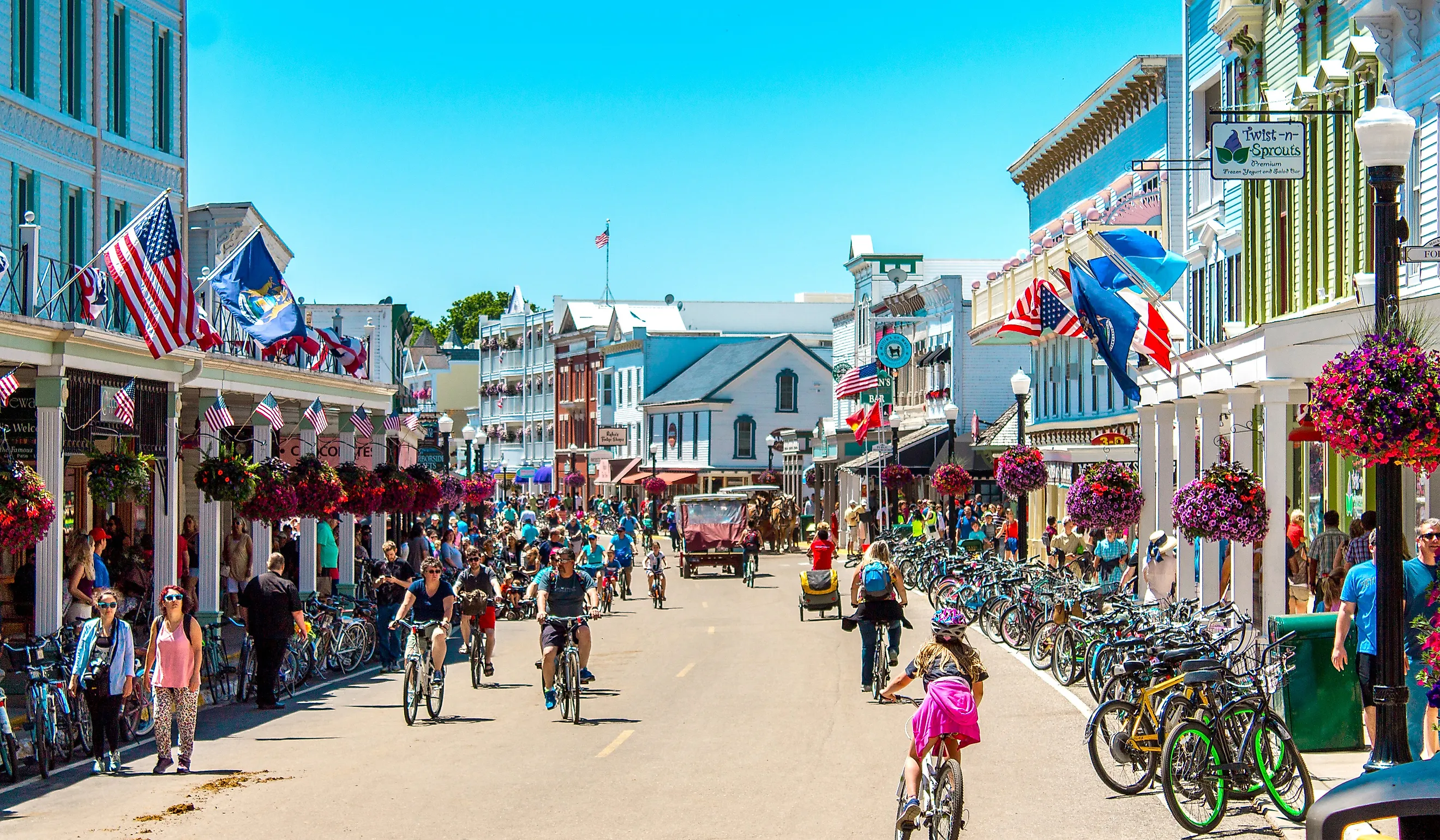 A busy day in downtown Mackinac Island, Michigan. Image credit: Michael Deemer via Shutterstock.com.