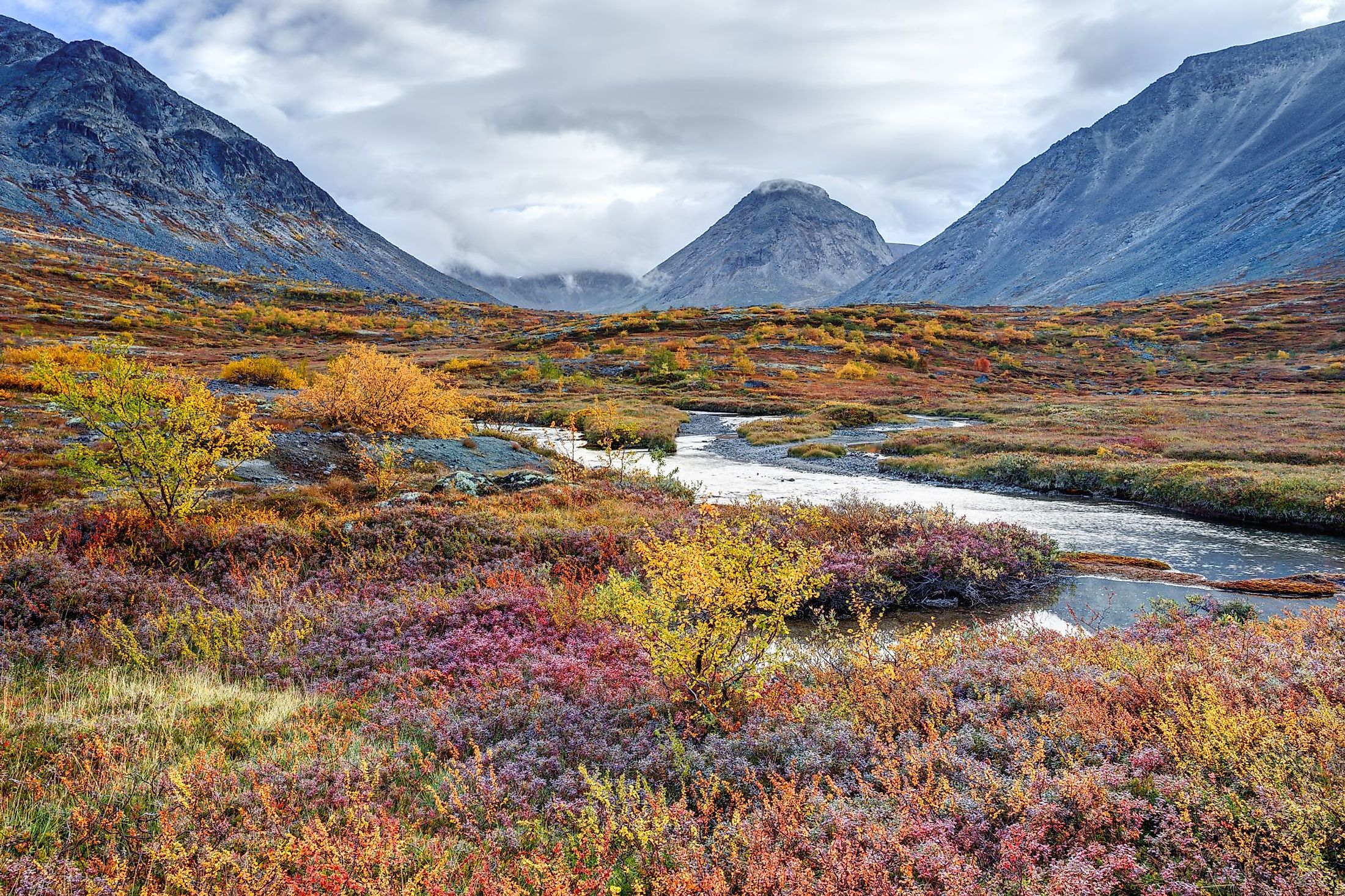 Colorful autumn tundra in front of the Malaya Belaya river bend in Hibiny Mountains above the Arctic Circle, Russia