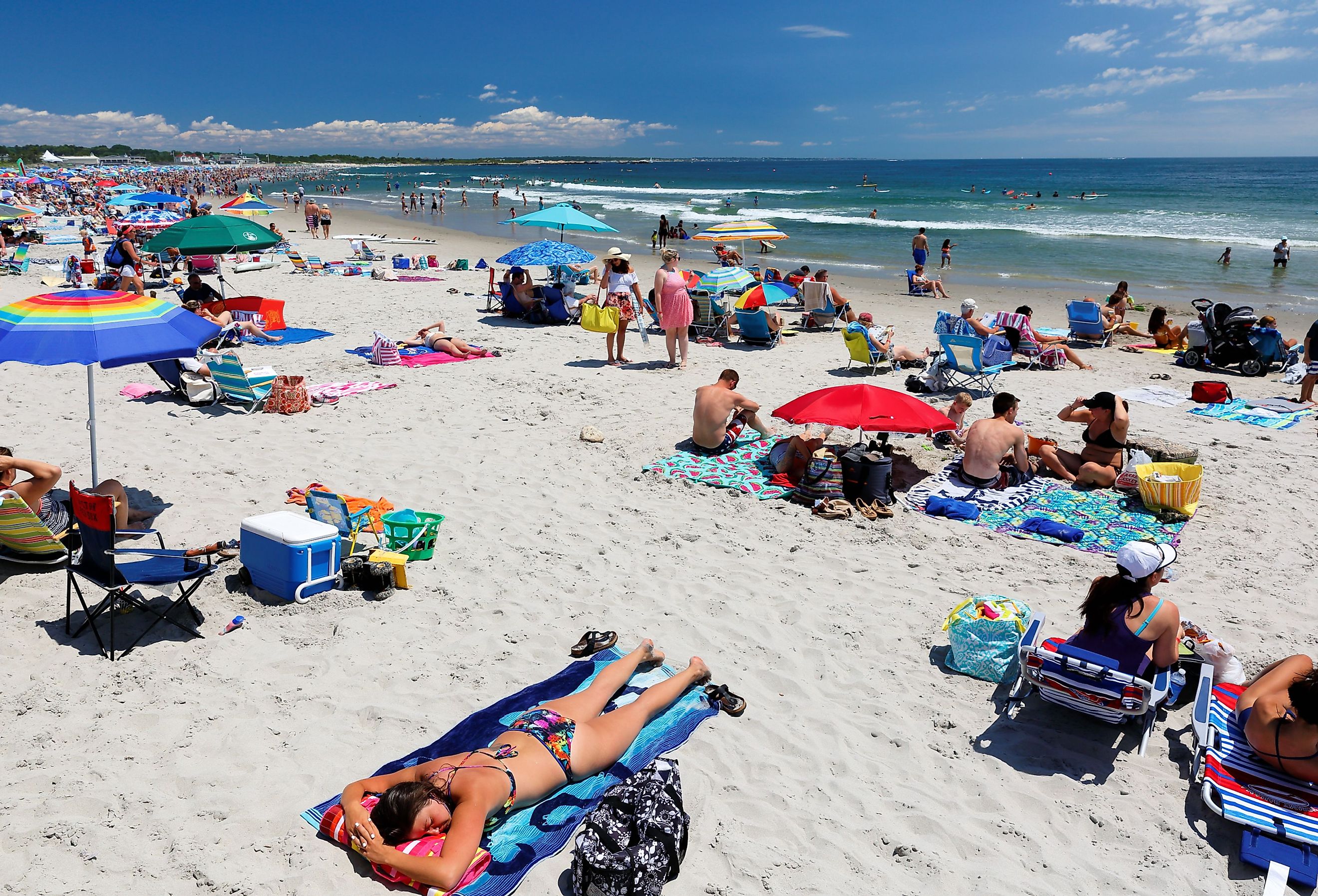 People relaxing at Narragansett Town Beach on a sunny day. Image credit Jay Yuan via Shutterstock