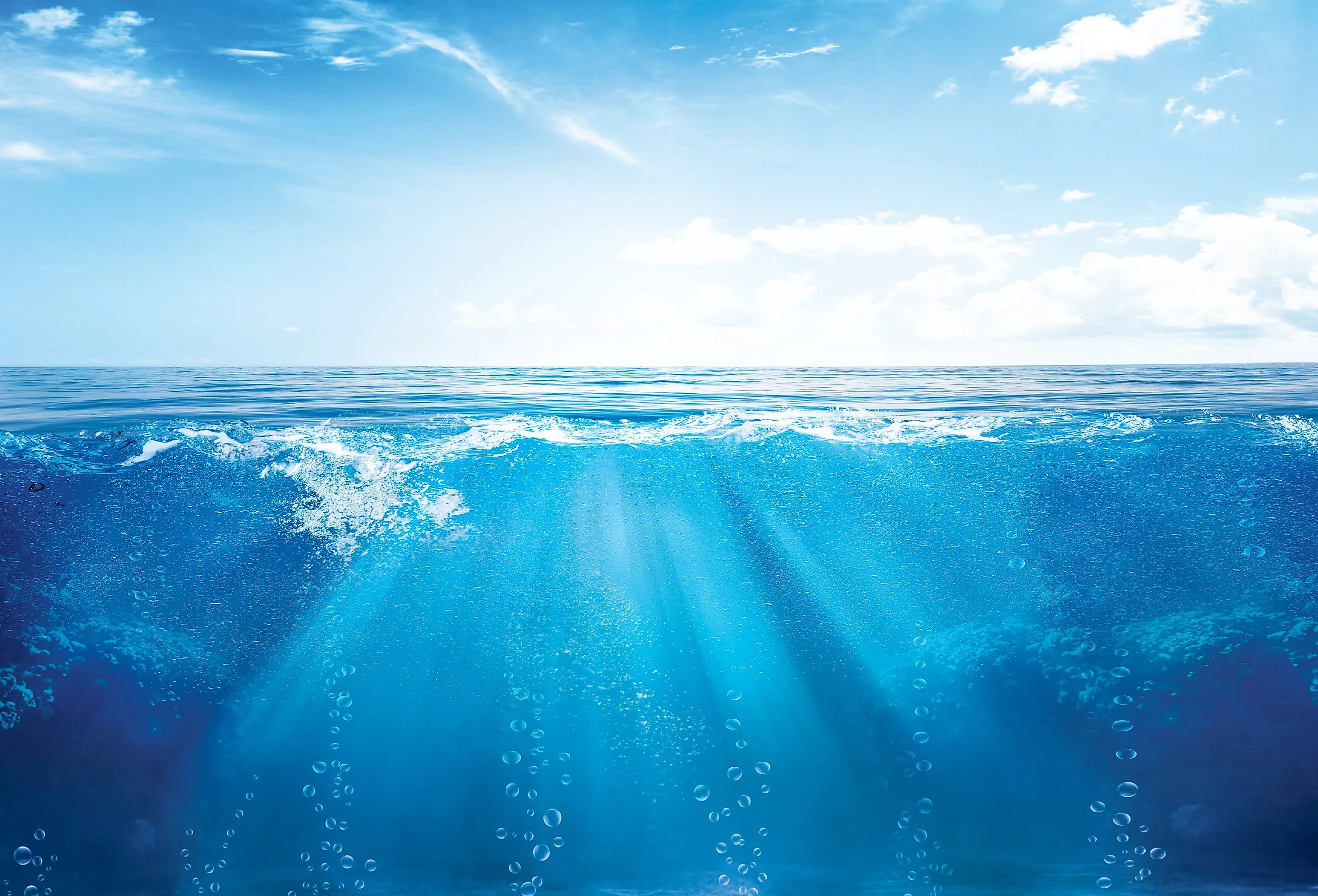 Blue sky and bubbles underwater.