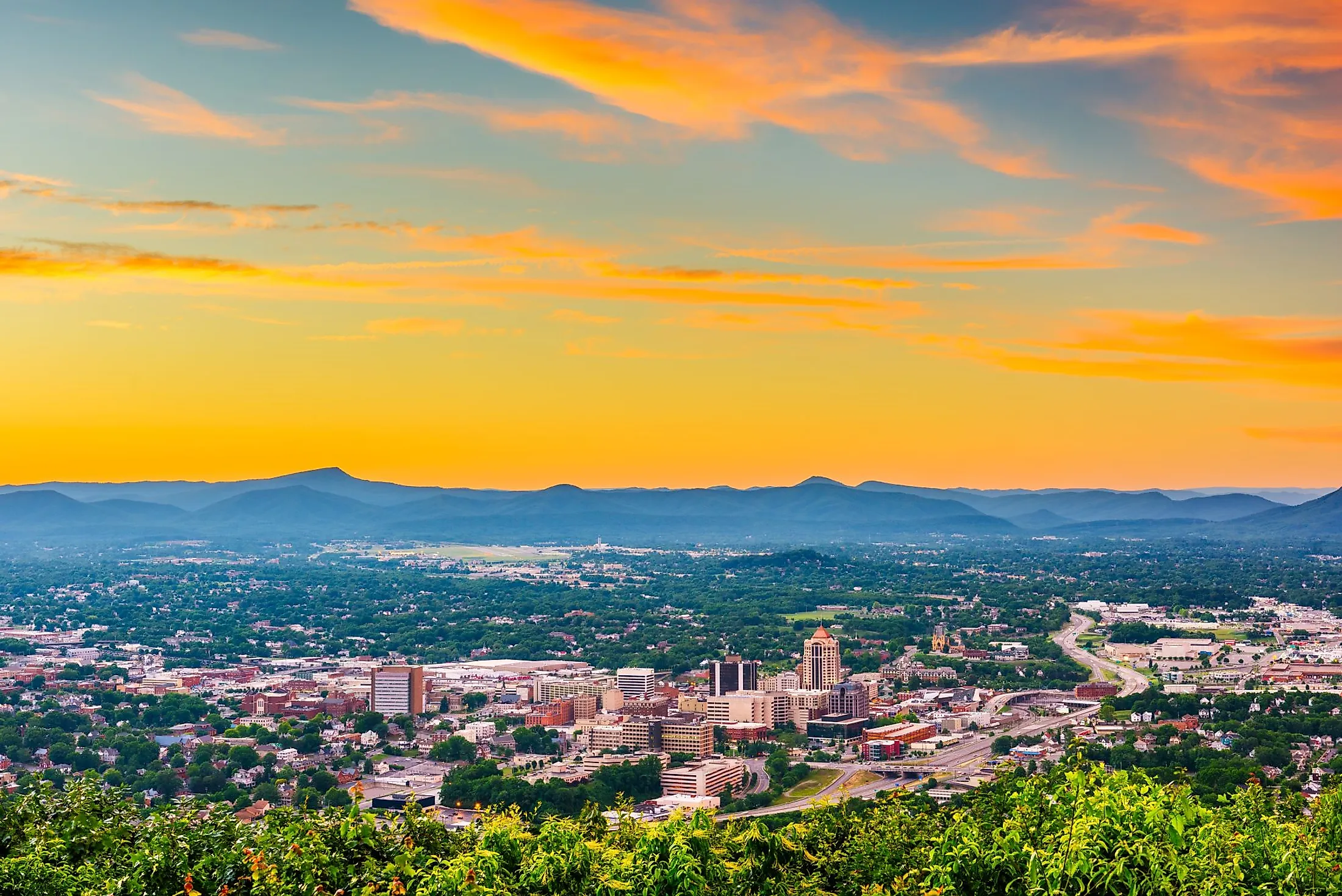 Roanoke, Virginia, downtown skyline from above at dusk. 