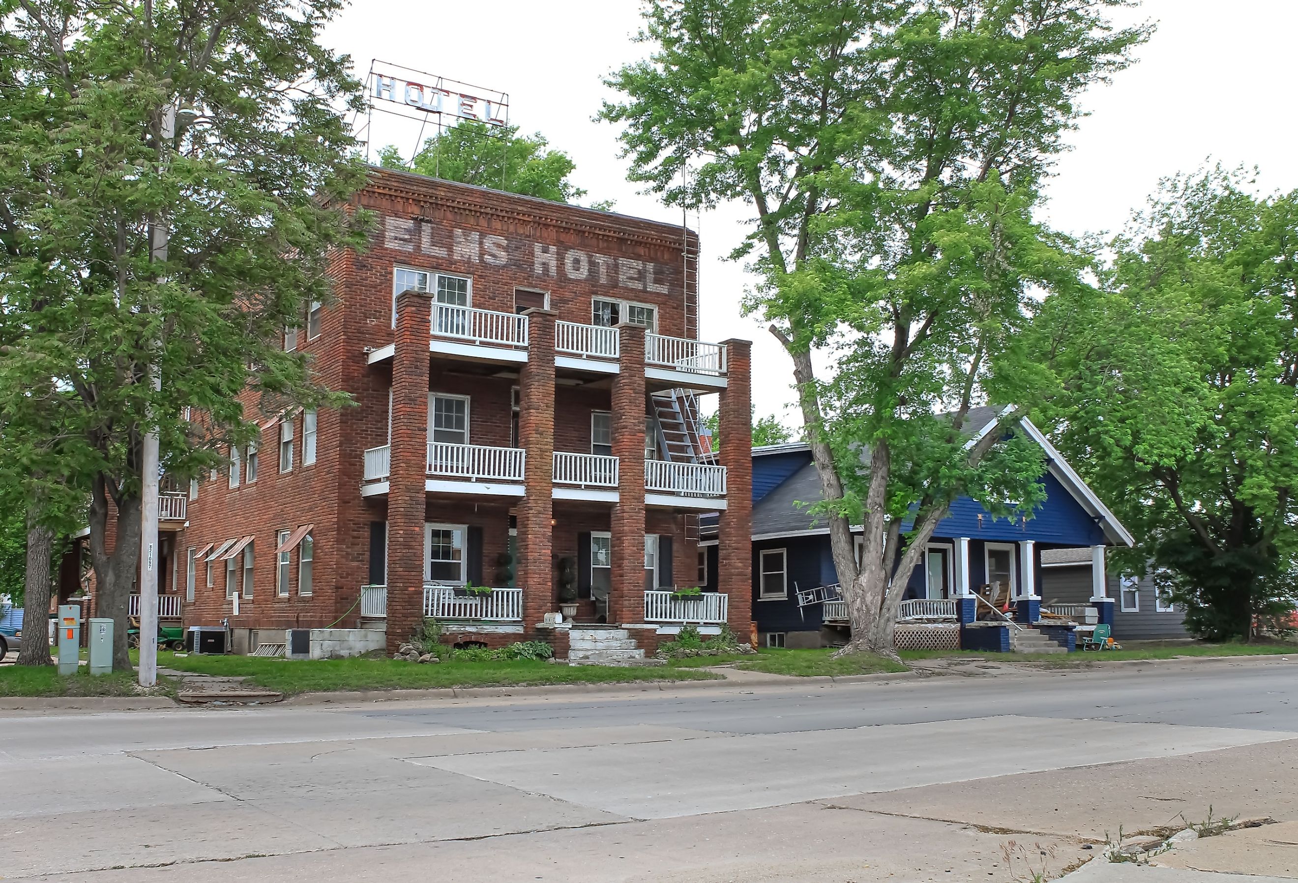 An old brick hotel building during the summer season, Abilene, Kansas. Image credit Sabrina Janelle Gordon via Shutterstock