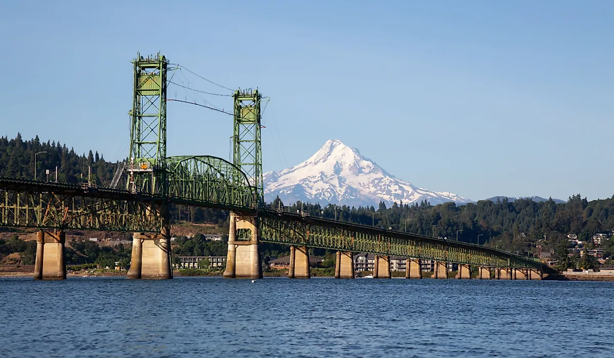 Hood River Bridge going over Columbia River with Mt Hood in the background.